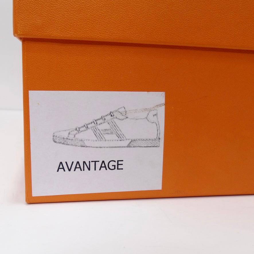 Hermes presents their take on the classic every day sneaker with this sleek ‘Avantage’ silhouette. White calfskin leather sneakers in with a contrasting black “H en Biais” motif. Featuring white goatskin insoles and lining as well as a white rubber