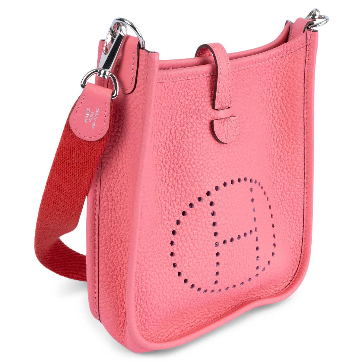 100% authentic Hermès Evelyne 16 TPM Crossbody Bag in Rose Azalee pink Taurillon Clemence leather with Rouge Pivoine red wool sangle strap, perforated leather 