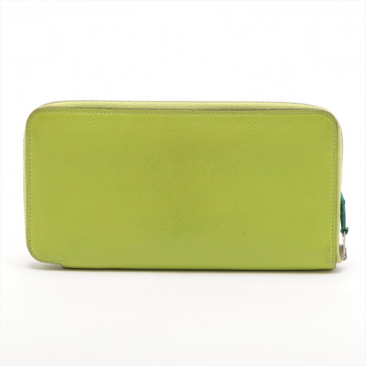 The Hermès Azap Veau Epsom Long Zippy Wallet in Apple Green is a luxurious and practical accessory that exudes sophistication. Crafted from high-quality Veau Epsom leather, known for its durability and distinctive grain, the wallet showcases Hermès'