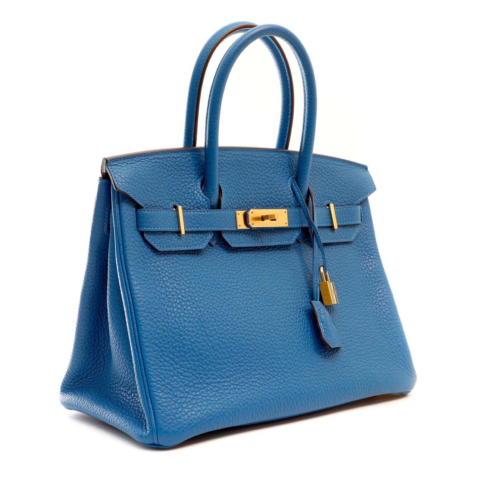 This authentic Hermès Azure Blue Togo 30 cm Birkin Bag is in pristine unworn condition with the protective plastic on hardware.  Particularly striking paired with gold hardware, this Birkin is a blue lover’s dream.

Togo is scratch resistant calf