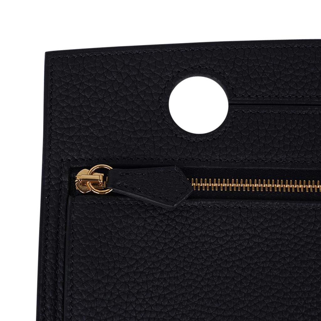 Mightychic offers an Hermes Backpocket 30 Pouch featured in Black.
Beautiful in Togo leather accentuated with Gold hardware.
This flat Backpocket fits easily over the handle and features a partitioned interior.
In a fabulous neutral color!  And fun