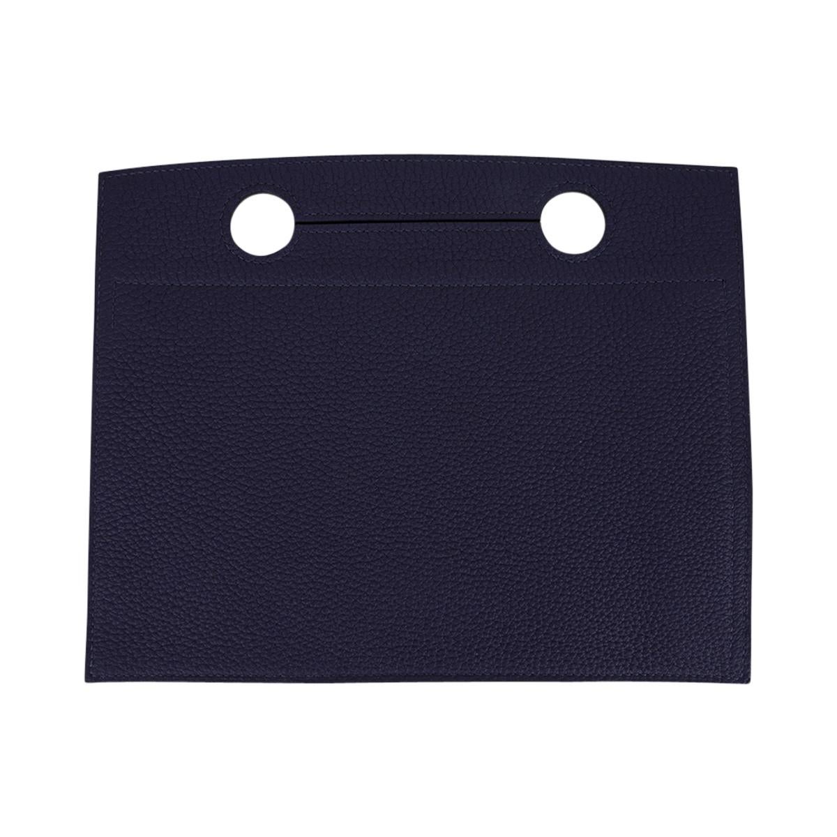 Mightychic offers an Hermes Backpocket 30 Pouch featured in Blue Nuit.
Fits 30 cm Birkin bag, however you can certainly use it on your 25 Birkin bag.
Beautiful in Togo leather with Palladium hardware.
This flat Backpocket fits easily over the handle