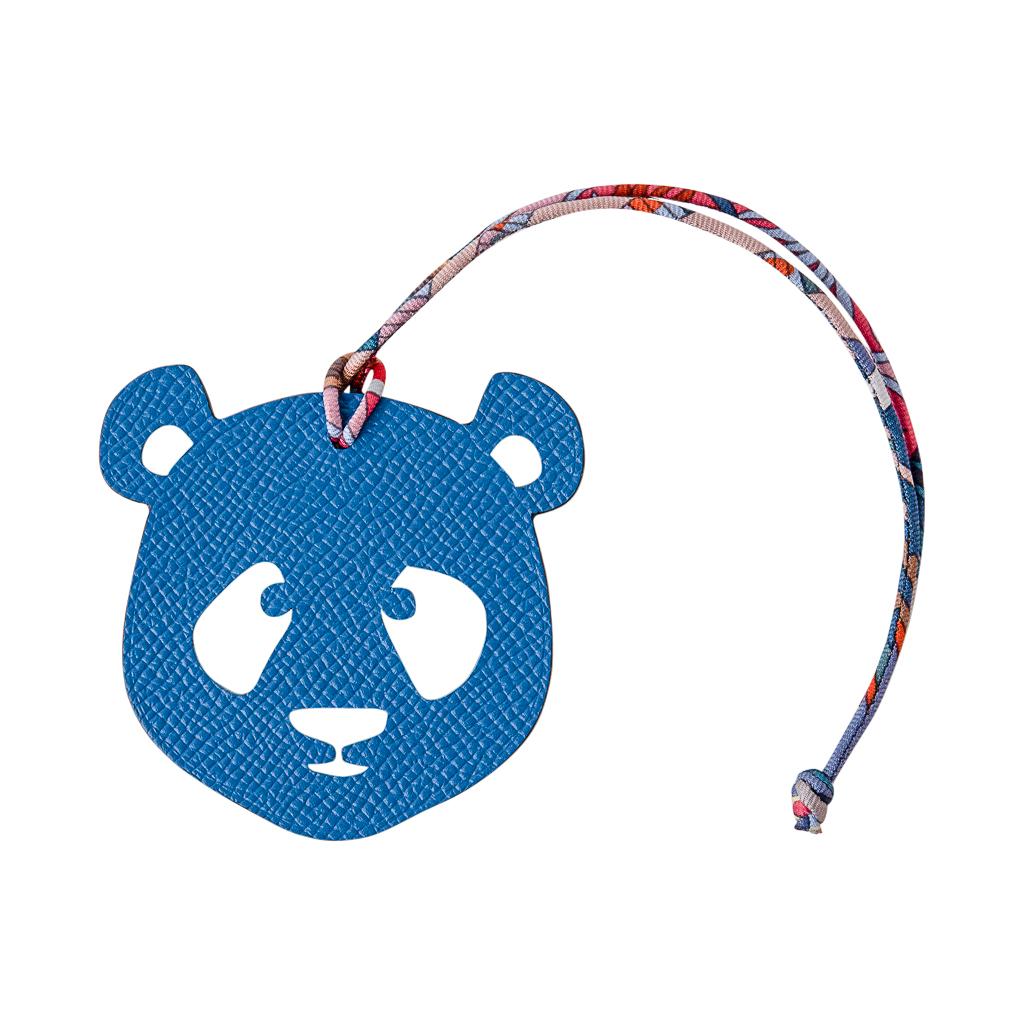 Coveted Hermes Petit h Bi-Color Panda bag charm with silk twill cord.
This whimsical charm comes in Rose Eglantine in Togo and Blue in Epsom .
This iconic Hermes accessory can be worn in a myriad of ways to add a playful touch to your wardrobe.
And