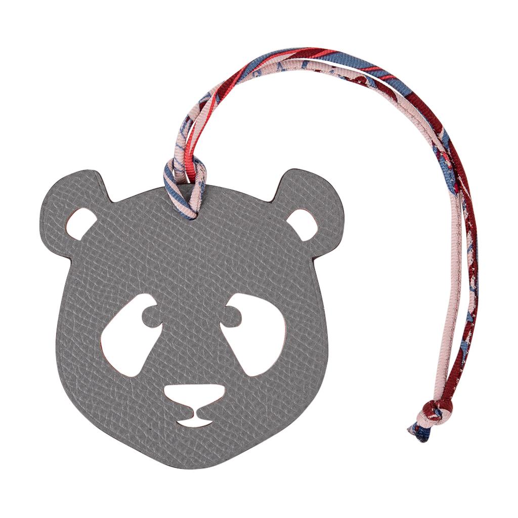 Coveted Hermes Petit h Bi-Color Panda bag charm with silk twill cord.
This whimsical charm comes in Rouge H in Togo and Gray Epsom.
This iconic Hermes accessory can be worn in a myriad of ways to add a playful touch to your wardrobe.
And of course