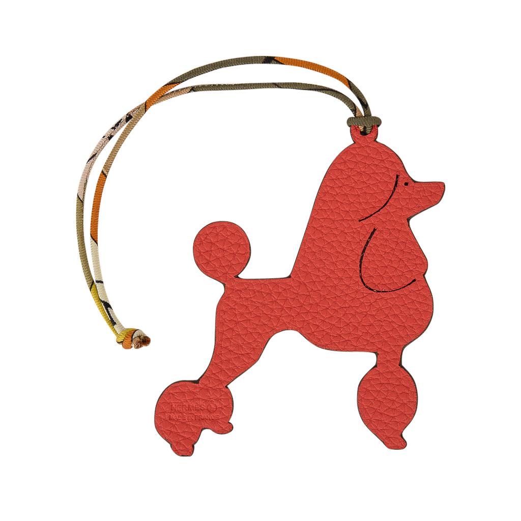 Guaranteed authentic coveted Hermes Petit h Bi-Color Poodle bag charm with silk twill cord.
This whimsical charm comes in Rouge in Togo and Blue in Epsom and can be worn as a bag charm or key holder.
This iconic Hermes accessory can be worn in a
