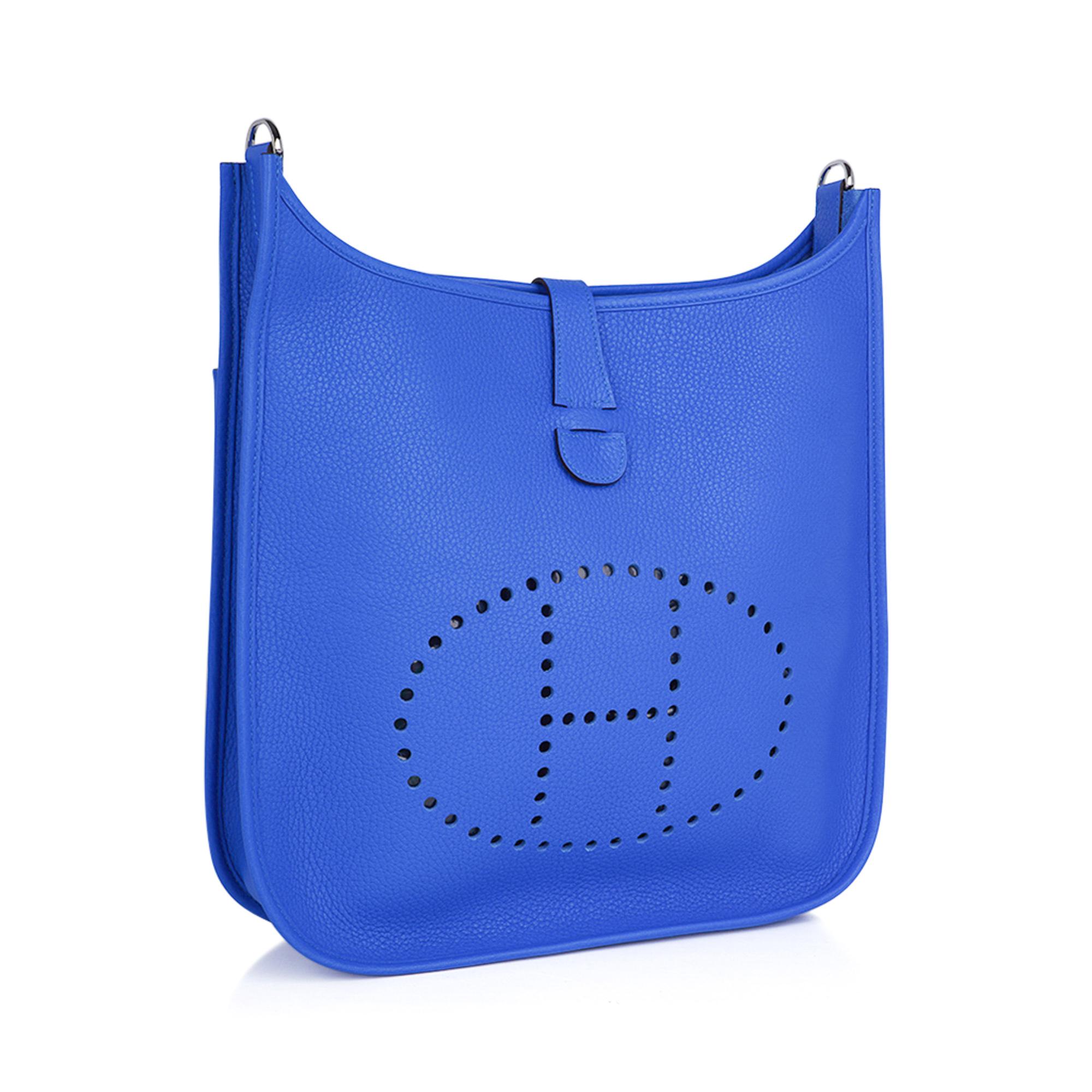 Mightychic offers an Hermes Evelyne GM featured in vibrant Bleu Hydra.
Bright and bold this splash of colour is a perfect accent to any wardrobe.
Fresh with Palladium hardware and Clemence leather.
Fabulous shoulder or cross body bag with roomy