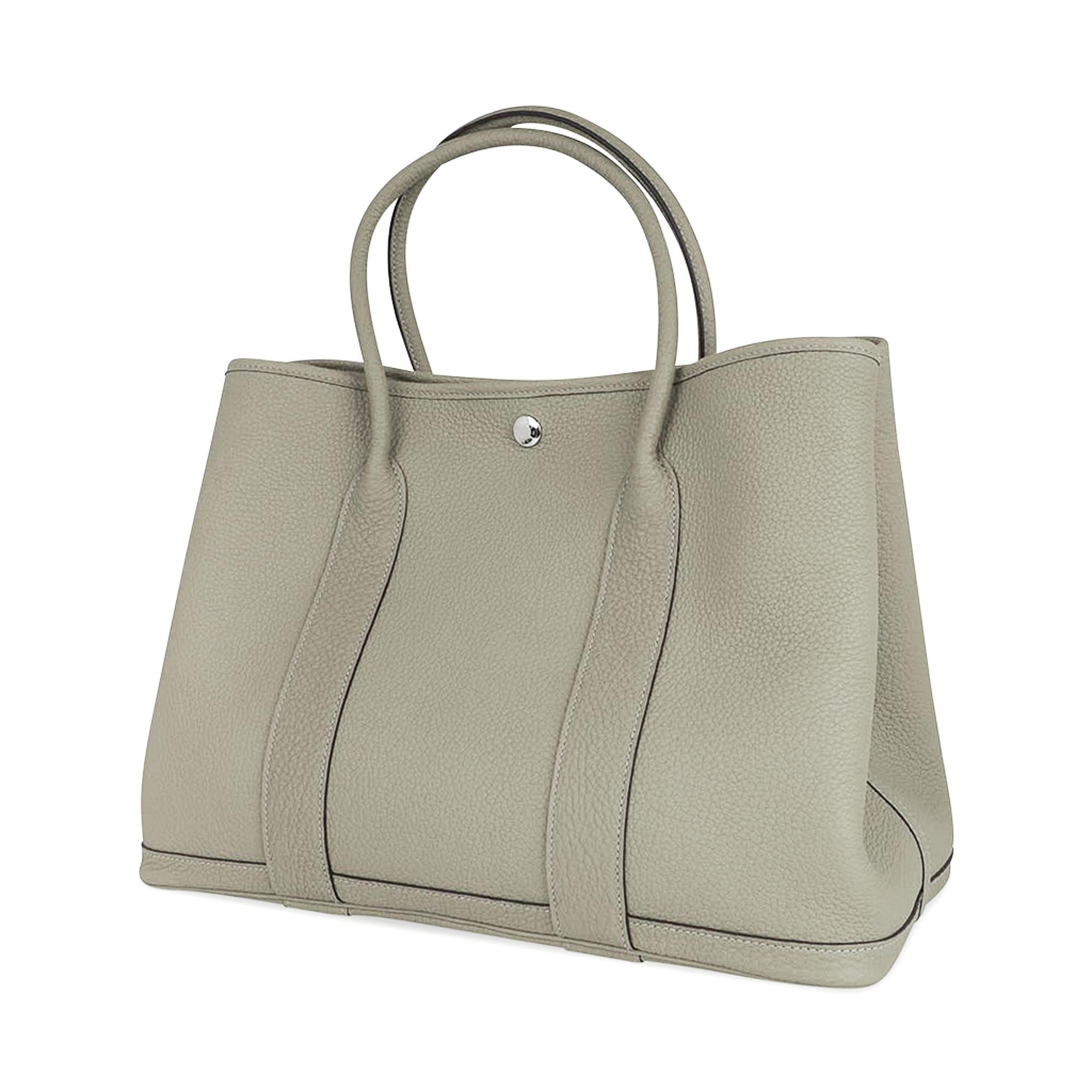 Mightychic offers an Hermes Garden Party 36 bag featured in Sage Negonda leather.
This beautiful shade of gray-green is neutral perfection, and
is the perfect about town tote.
Accentuated with palladium Clou de Selle.
Chevron canvas lining and