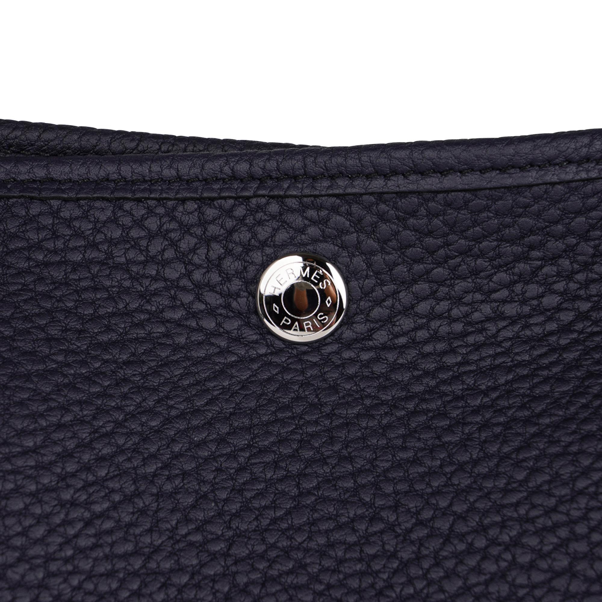 Mightychic offers a guaranteed authentic Hermes Garden Party 36 Pockets bag featured in Blue Indigo.
This rich colour is accentuated in plush Negonda leather.
Fresh palladium Clou de Selle hardware.
Herringbone canvas lining and interior zipper