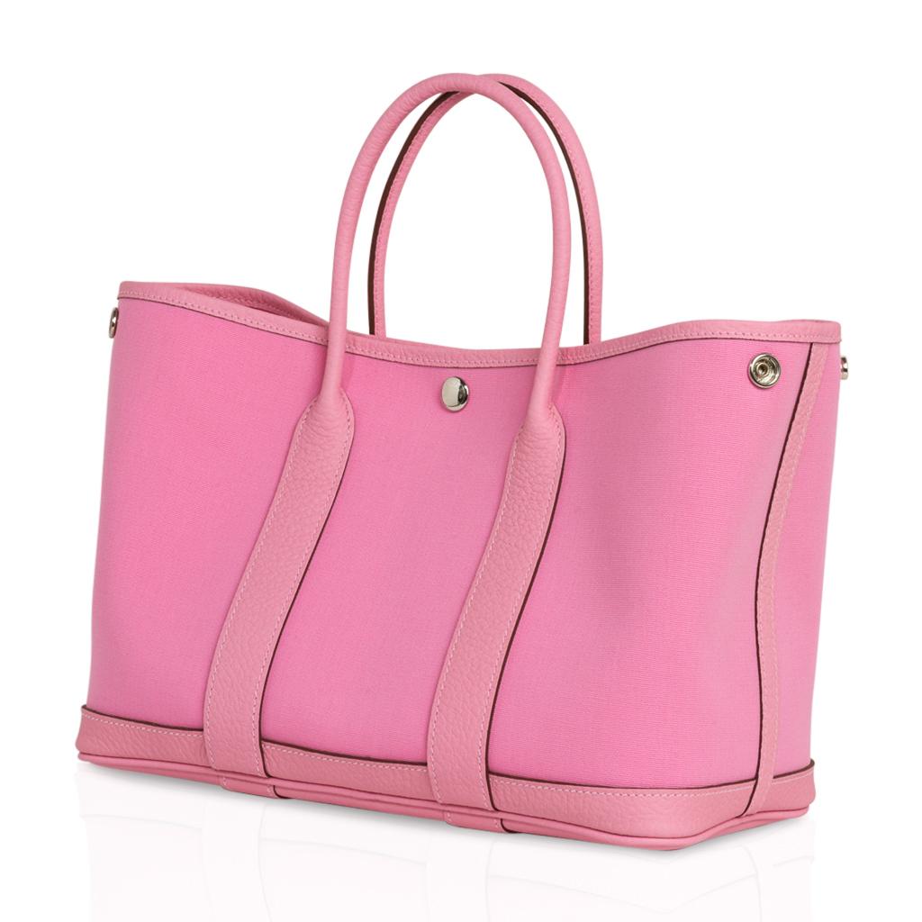 Guaranteed authentic Hermes Toile Negonda Garden Party 30 bag featured in 5P Pink. 
Durable and strong canvas reinforced with the leather base and sides that end in the rolled handles. 
Accentuated with palladium Clou de Selle. 
Comes with signature