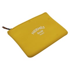 Hermès Bain clutch in yellow neoprene and nylon 