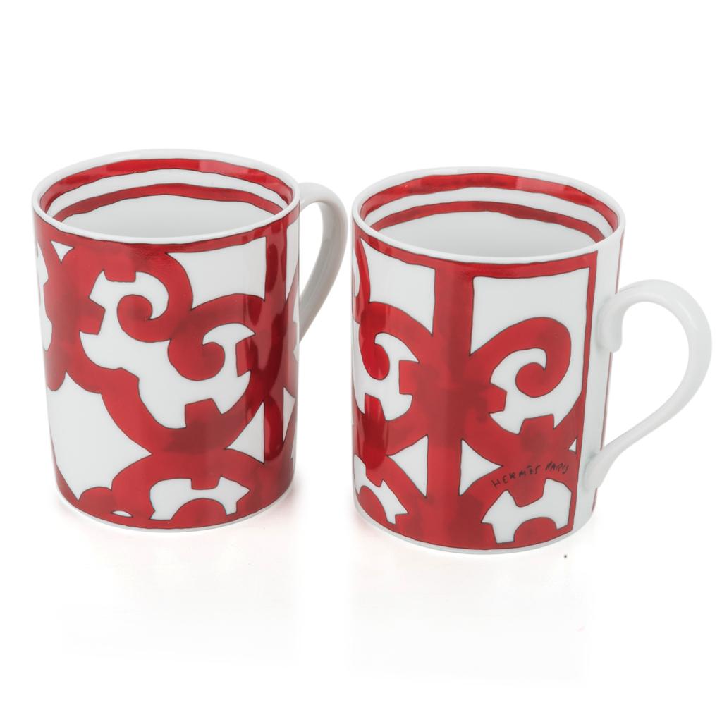 Guaranteed authentic Hermes Balcon Du Guadalquivir No 1 set of 2 (two) porcelain mugs.
Features the ironwork of Andalusian towns.
Each 10 oz mug is porcelain.
These bold beautiful red and white mugs are a lovely addition to any table.
A terrific