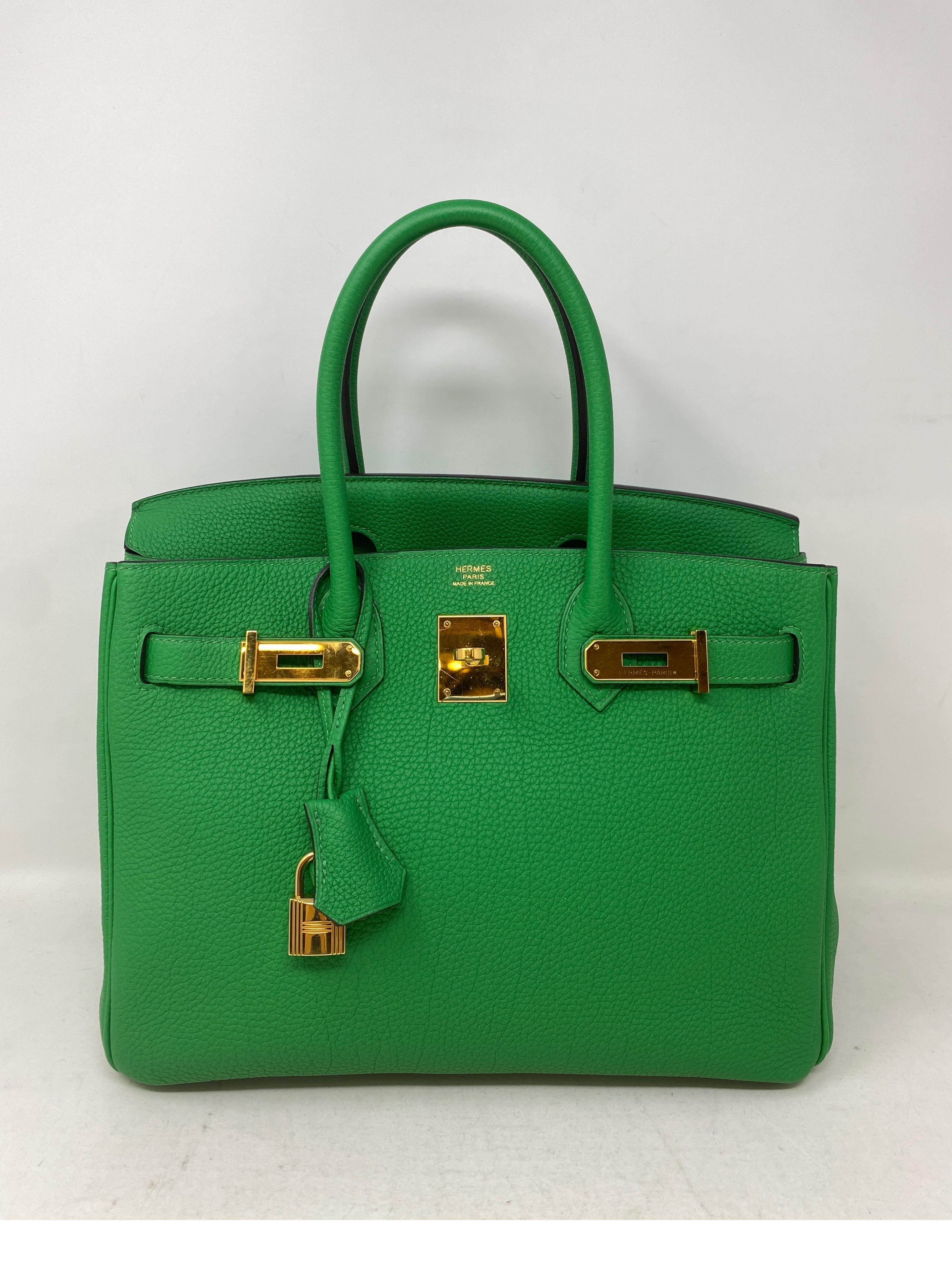 Hermes Bamboo Birkin 30 Bag. Beautiful bamboo green Birkin with gold hardware. Excellent like new condition. Togo leather. Rare combination. R square stamp. Plastic is still on the hardware. Includes clochette, lock, keys, and dust cover. Guaranteed