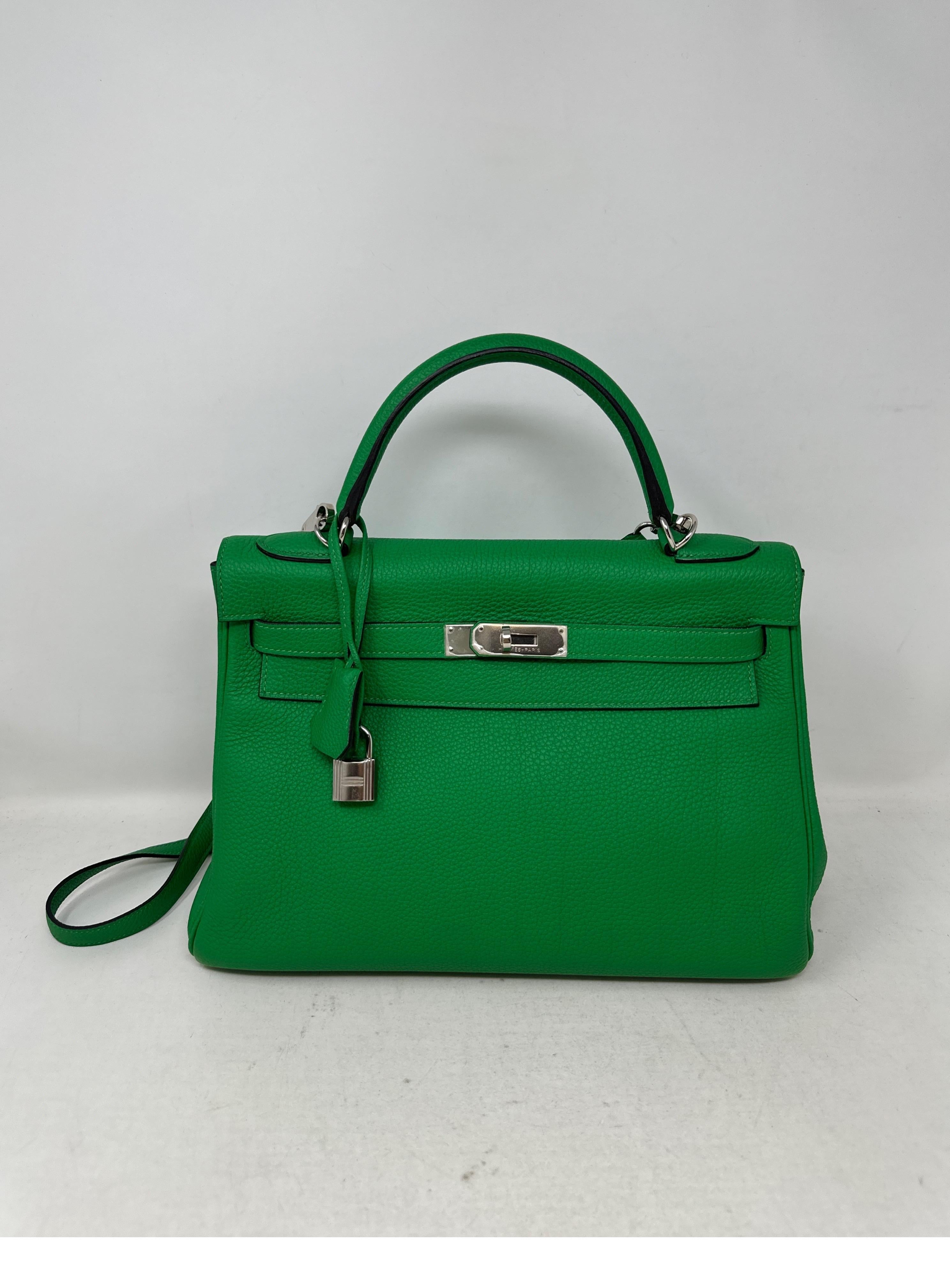 Hermes Bamboo Kelly 35 Bag. Excellent condition. Bamboo green color. Togo leather. Palladium silver hardware. Interior clean. Plastic still on hardware. Includes clcohette, lock, keys, and dust bag. Guaranteed authentic. 