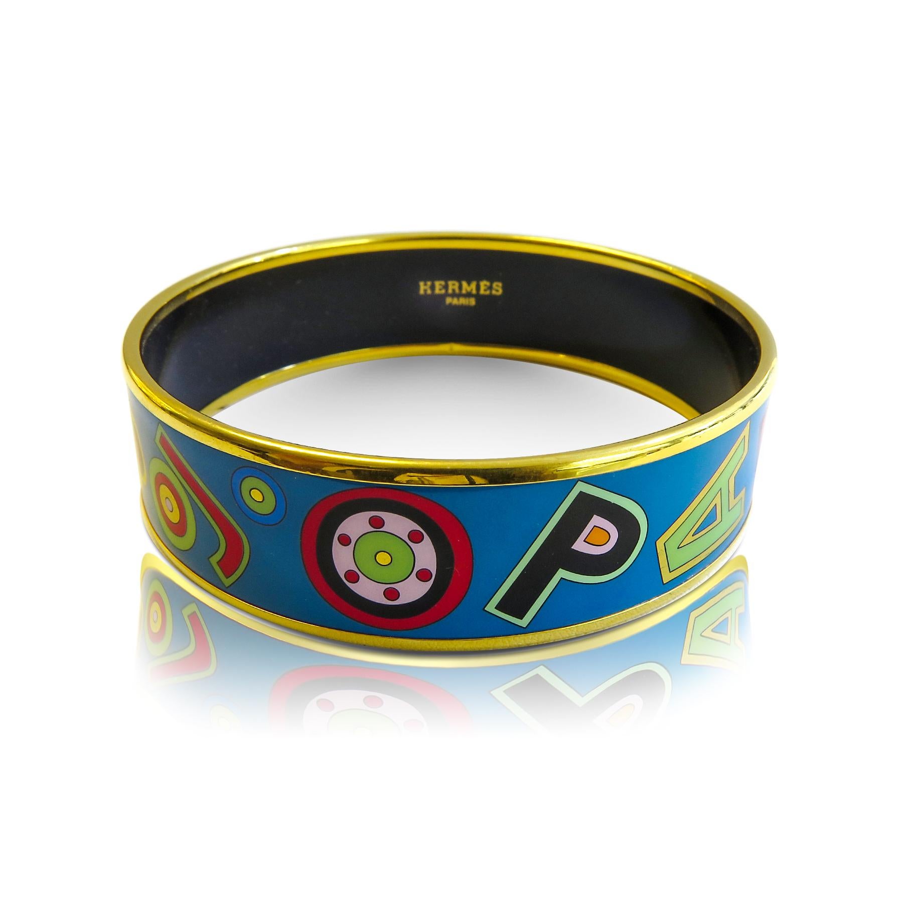 This Hermes bangle features an 18 Karat gold plated with a printed enamel. Carved in Austria, It weighs 41.6 grams, 20mm wide and has an inner diameter of 2.7 inches to give a comfortable fit in your wrist.

Condition: Excellent 
