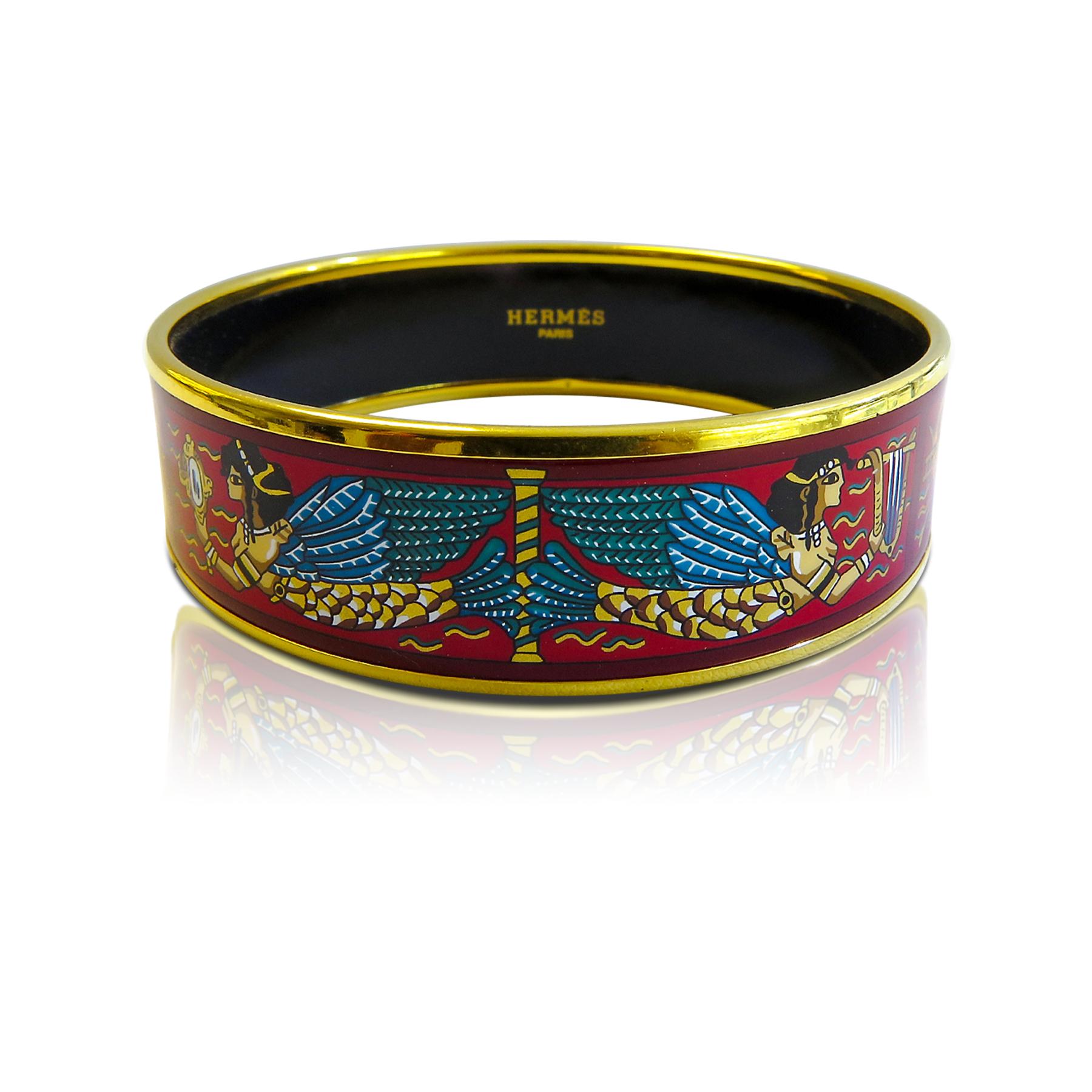 This Hermes bangle features an18 Karat gold plated with a printed enamel. Carved in Austria, It weighs 40.8 grams, 20mm wide and has an inner diameter of 2.5 inches to give a comfortable fit in your wrist.

Condition: Excellent 