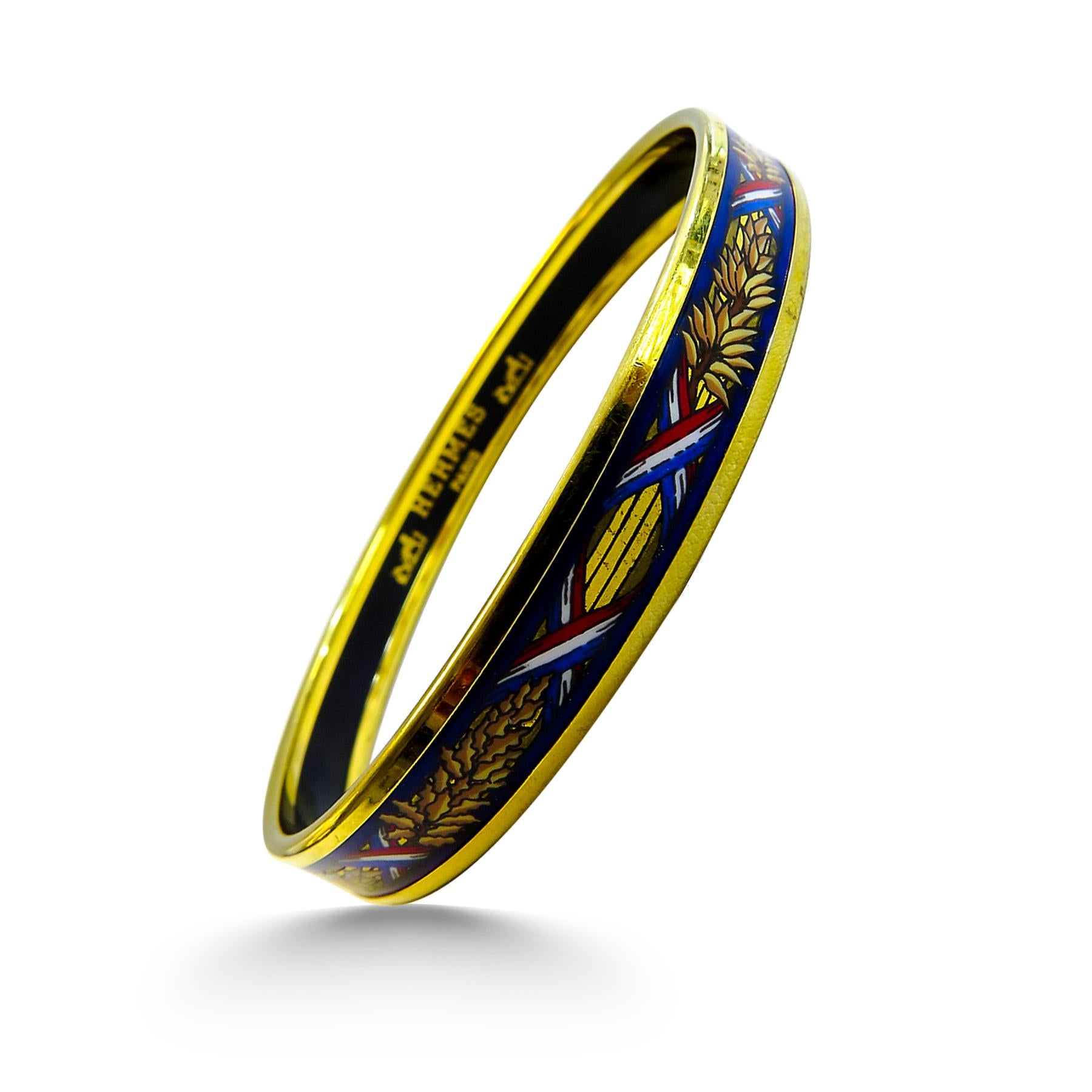 This Hermes bangle features an 18 Karat gold plated with a printed enamel. Carved in Austria, It weighs 20.5 grams, 10mm wide and has an inner diameter of 2.7 inches to give a comfortable fit in your wrist.

Condition: Good (sign of wear and minor