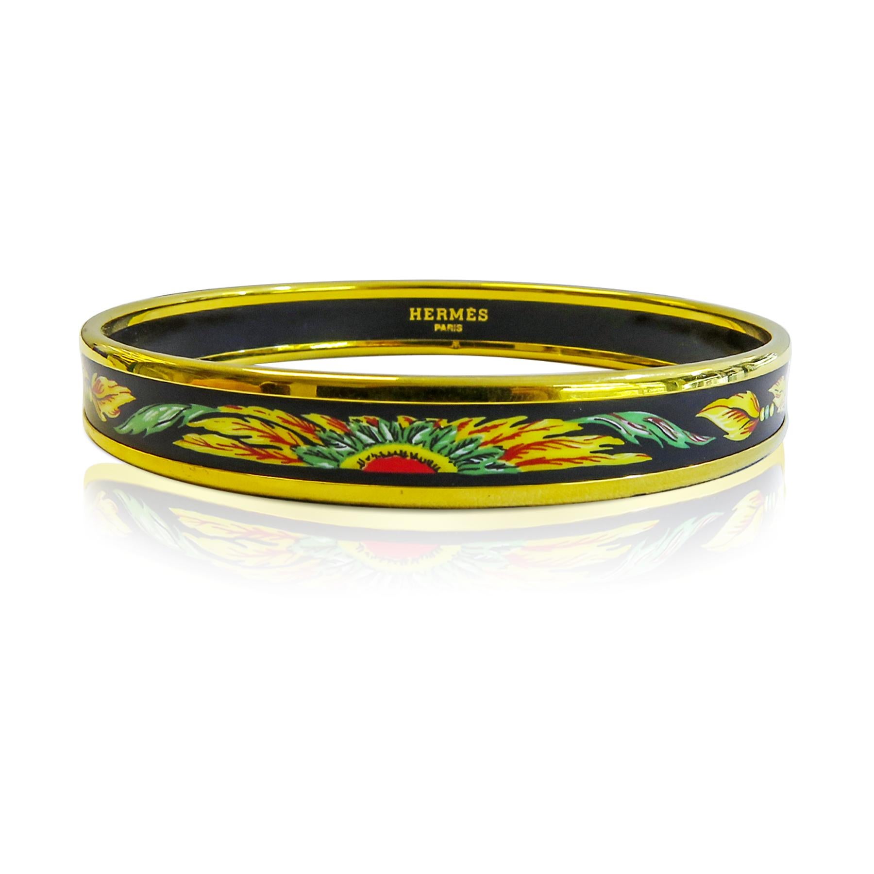 This Hermes bangle features an 18 Karat gold plated with a printed enamel. Carved in Austria, It weighs 22.9 grams, 10mm wide and has an inner diameter of 2.7 inches to give a comfortable fit in your wrist.

Condition: Excellent ( There is small