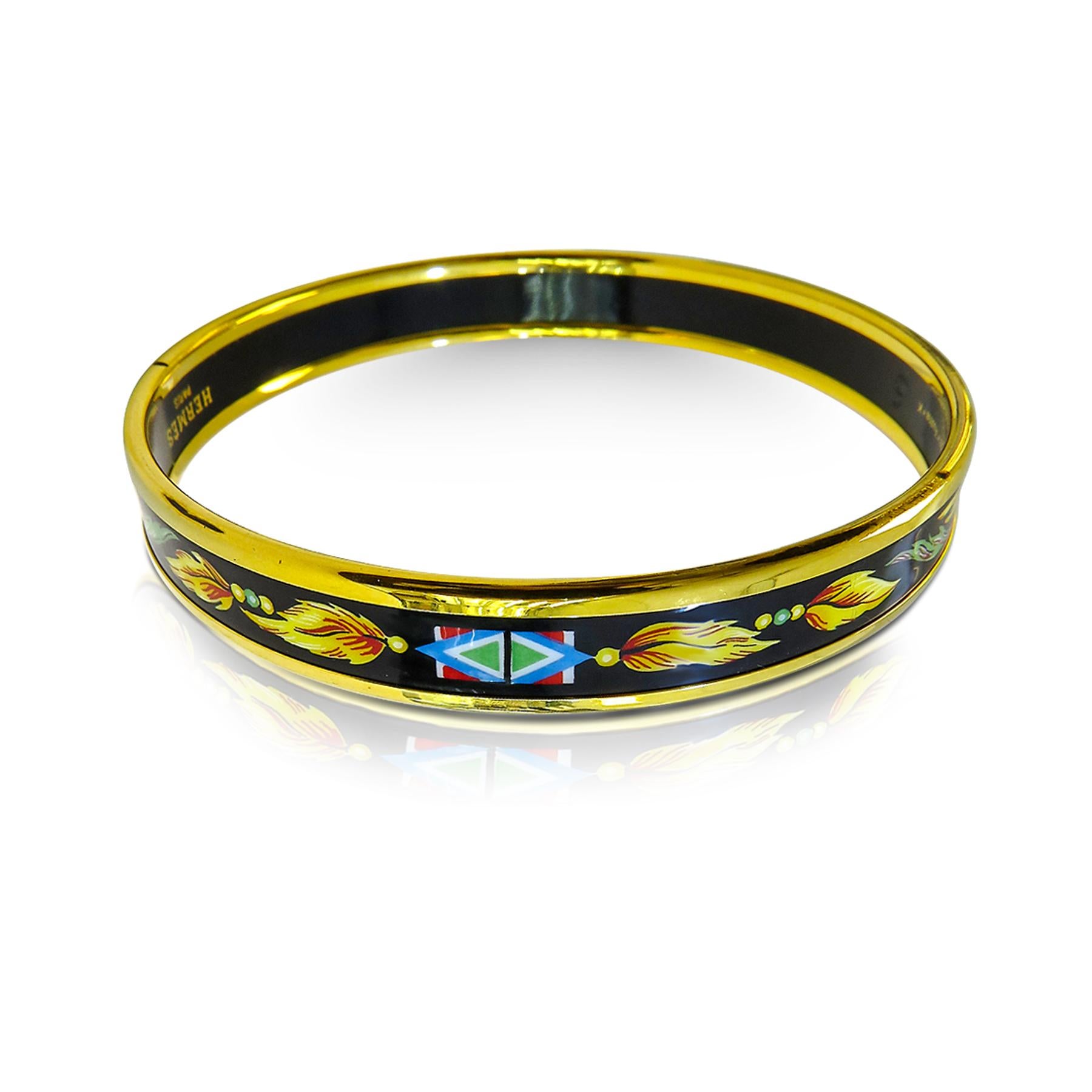 This Hermes bangle features an 18 Karat gold plated with a printed enamel. Carved in Austria, It weighs 48 grams, 10mm wide and has an inner diameter of 2.7 inches to give a comfortable fit in your wrist.
 
Condition: Good, in one side it has