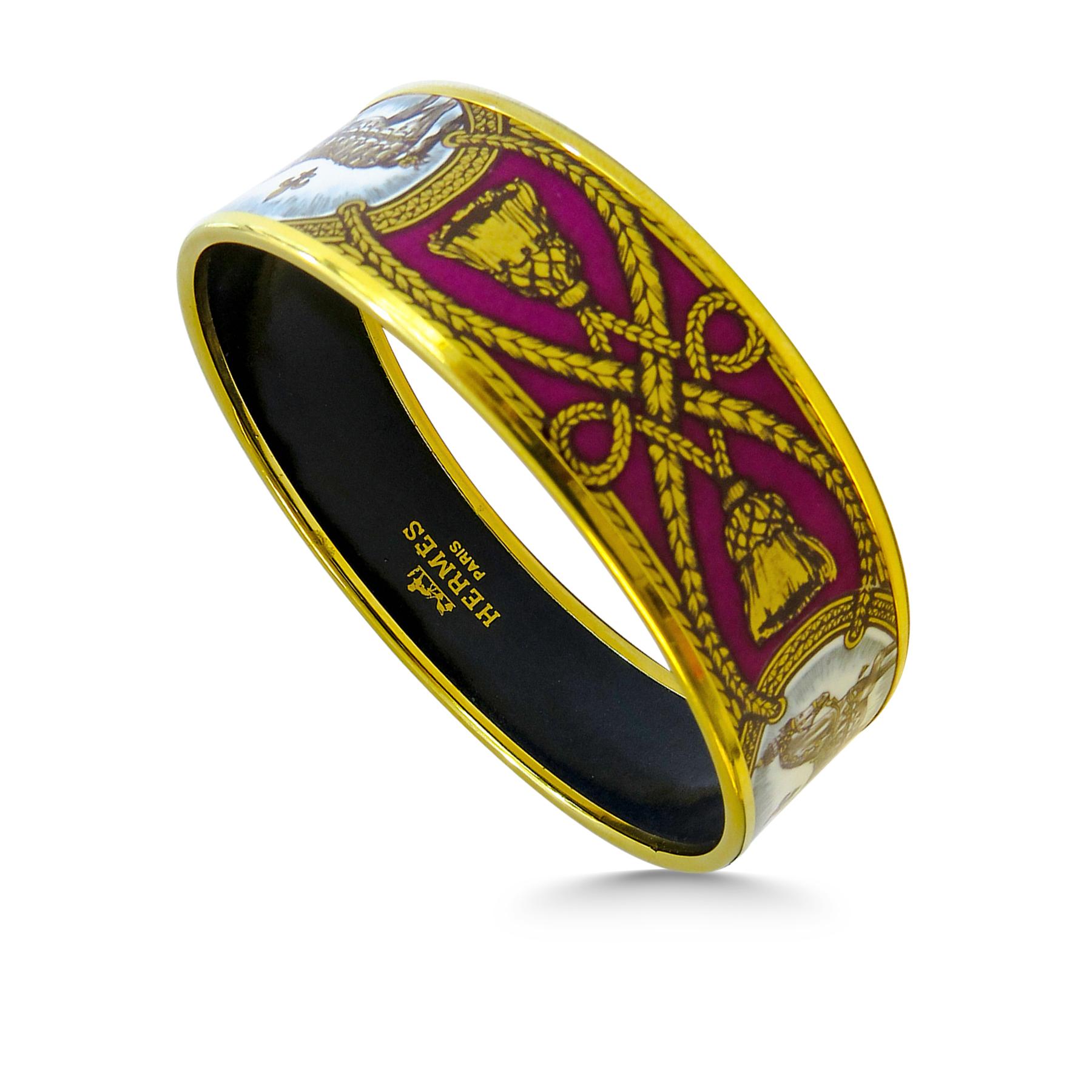 This Hermes bangle features an 18 Karat gold plated with a printed horse pattern enamel. Carved in Austria, It weighs 44.5 grams, 20mm wide and has an inner diameter of 2.7 inches to give a comfortable fit in your wrist.
 
Condition: Excellent