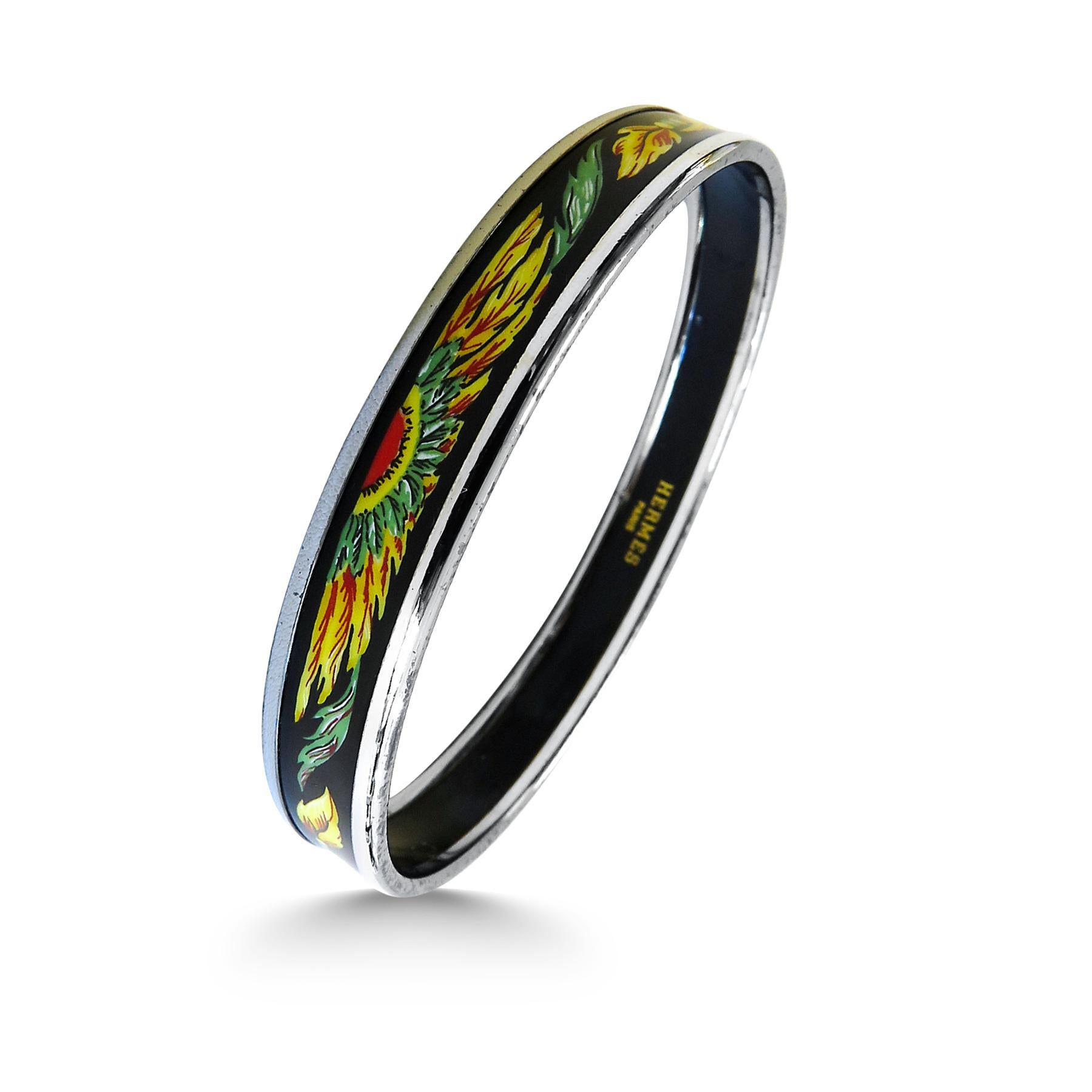 This Hermes bangle features platinum plated with a printed enamel. Carved in Austria, It weighs 22.5 grams, 10mm wide and has an inner diameter of 2.7 inches to give a comfortable fit in your wrist.

Condition: Discoloration on both sides and edges  