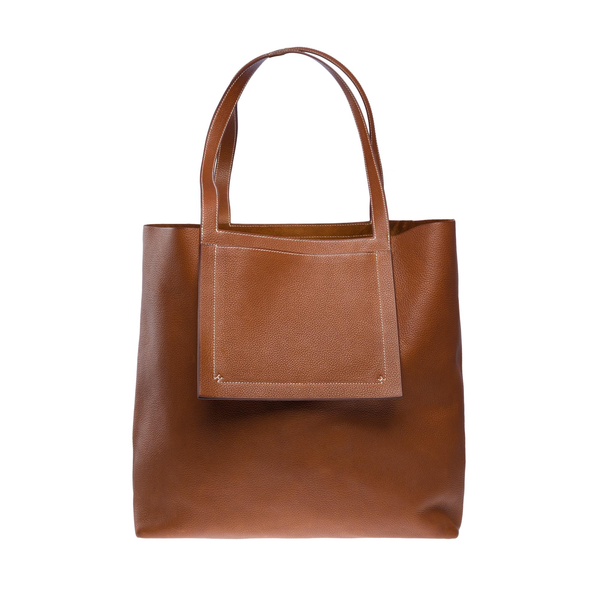Gorgeous​ ​Hermes​ ​Barenia​ ​Faubourg​ ​Fauve​ ​Cabasellier​ ​46​ ​Tote​ ​bag​ ​with​ ​white​ ​stitching,​ ​featuring​ ​double​ ​fauve​ ​leather​ ​handles​ ​for​ ​hand​ ​or​ ​shoulder​ ​carry

Exterior​ ​flat​ ​pocket
Interior​ ​in​ ​fauve​