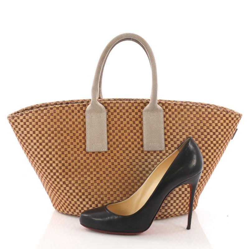 This Hermes Basket Weave Tote Woven Jute Small, crafted from beige woven jute, features dual rolled handles. It opens to a beige woven jute interior. **Note: Shoe photographed is used as a sizing reference, and does not come with the bag.