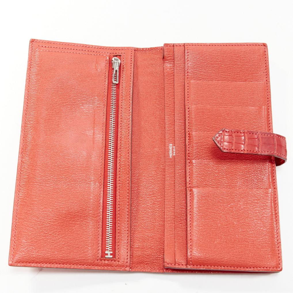 HERMES Bearne red scaled leather silver H logo long wallet
Reference: AAWC/A00987
Brand: Hermes
Model: Bearn
Material: Leather
Color: Red
Pattern: Animal Print
Closure: Loop Through
Lining: Red Leather
Extra Details: Herm√®s Bearn Classic Wallet.