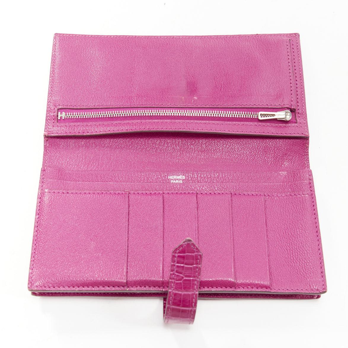 HERMES Bearne Soufflet Rose purple shiny scaled leather H silver logo long wallet
Reference: AAWC/A00986
Brand: Hermes
Model: Bearn
Material: Leather
Color: Purple, Silver
Pattern: Animal Print
Closure: Loop Through
Lining: Purple Leather
Extra