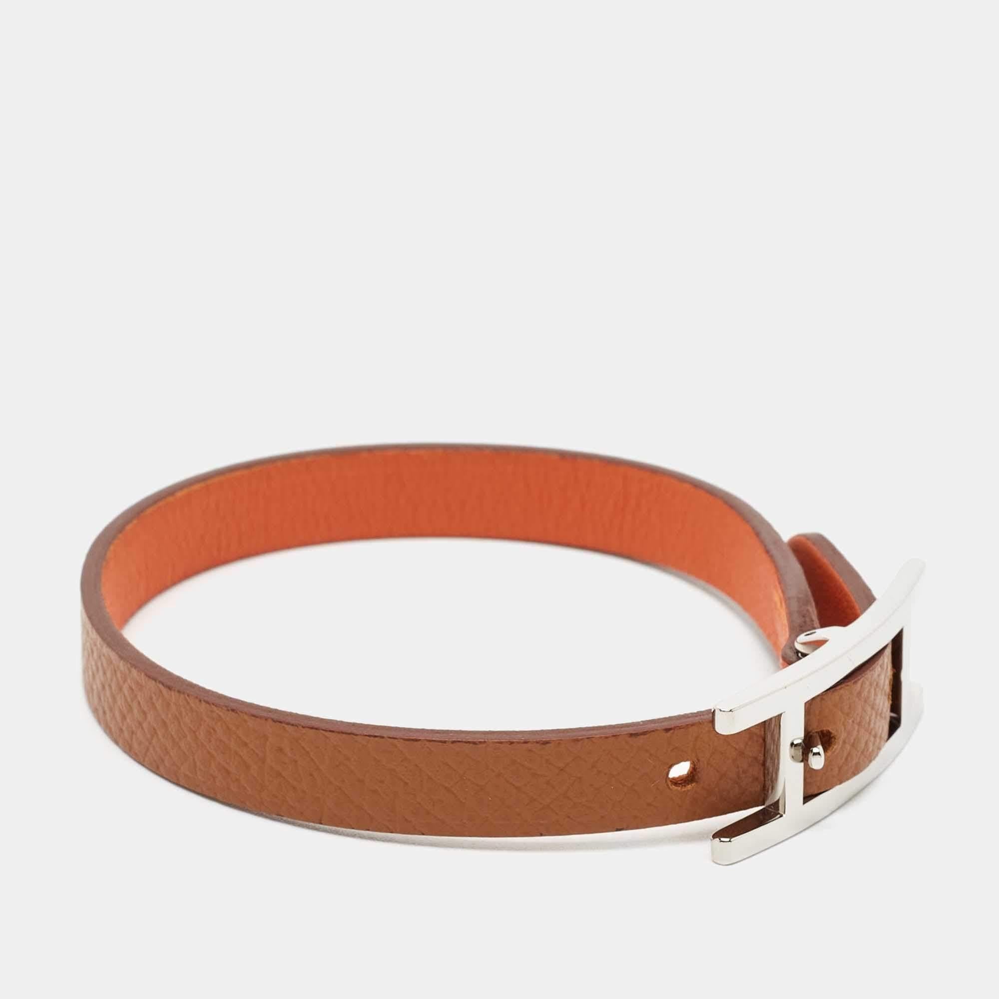 This classy Hermes bracelet can be worn over and over again once purchased. It will never go out of style. Constructed using brown and orange leather to be reversible, the piece is finished with a palladium-plated H buckle.

Includes: Original Box


