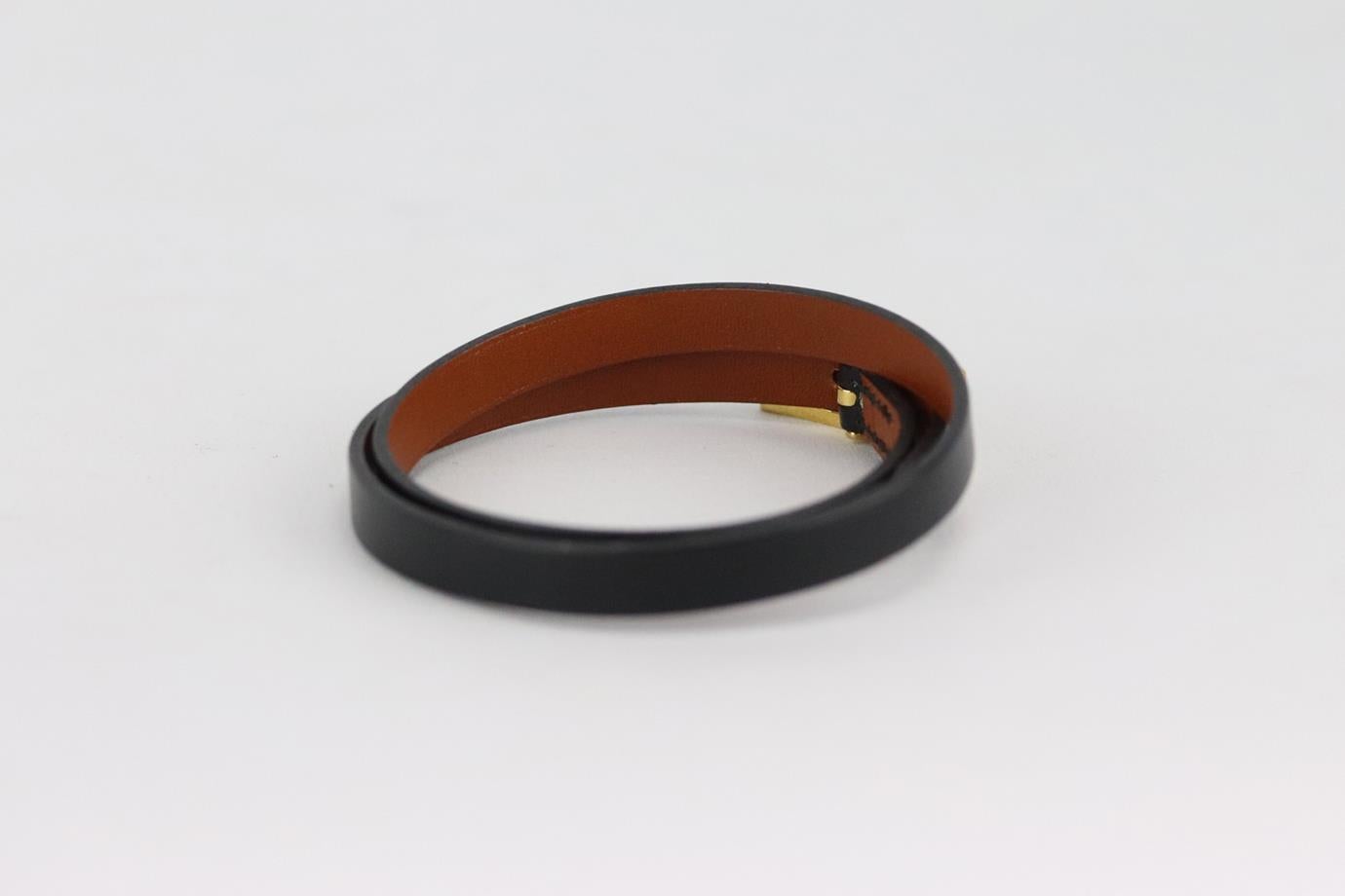 Hermès Behapi double tour leather bracelet. Black and tan. Buckle fastening at front. Does not come with box or dustbag. Length: 17.5 in. Very good condition - Light signs of wear; see pictures.
