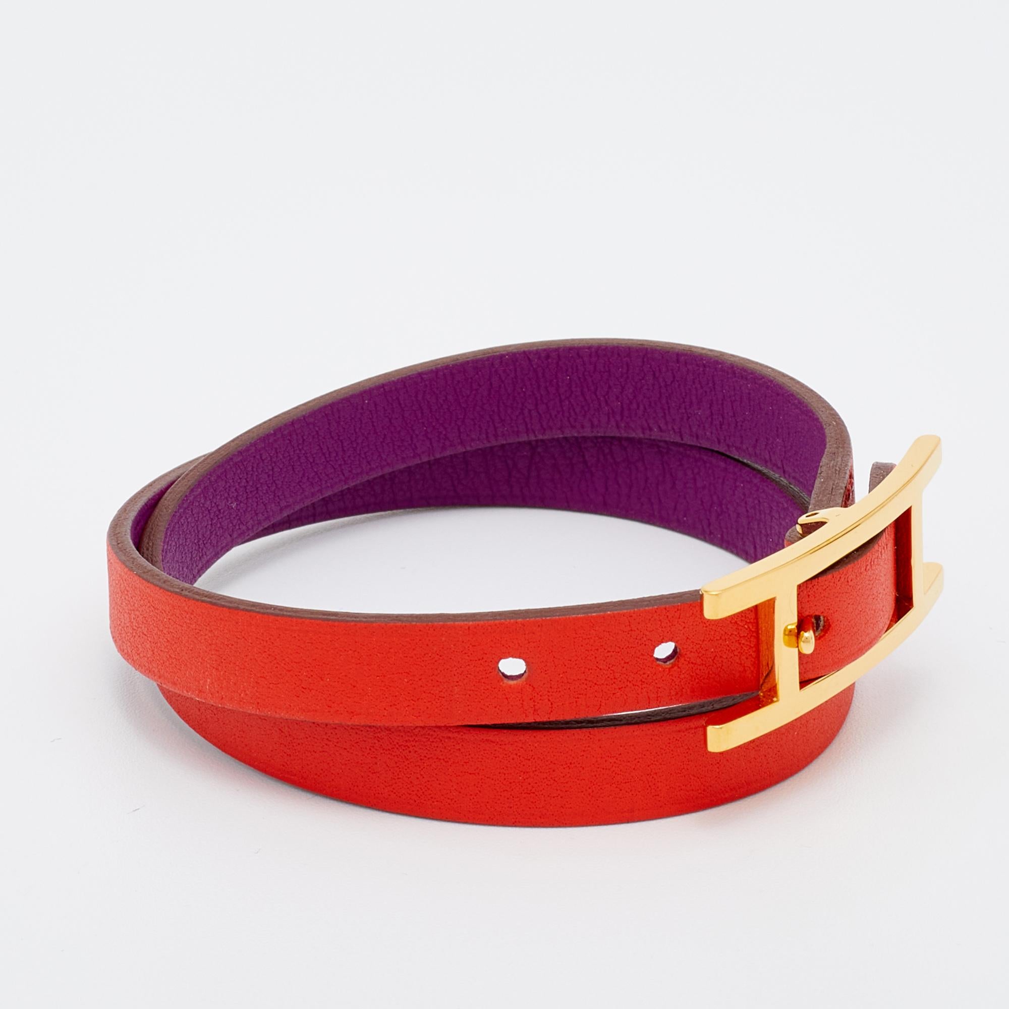 Exuding glamour and classic style, this stunning bracelet from the House of Hermes is something you'll love having around your wrist. It is a Behapi orange-purple leather creation that is enhanced with gold-plated metal. This cute bracelet can be