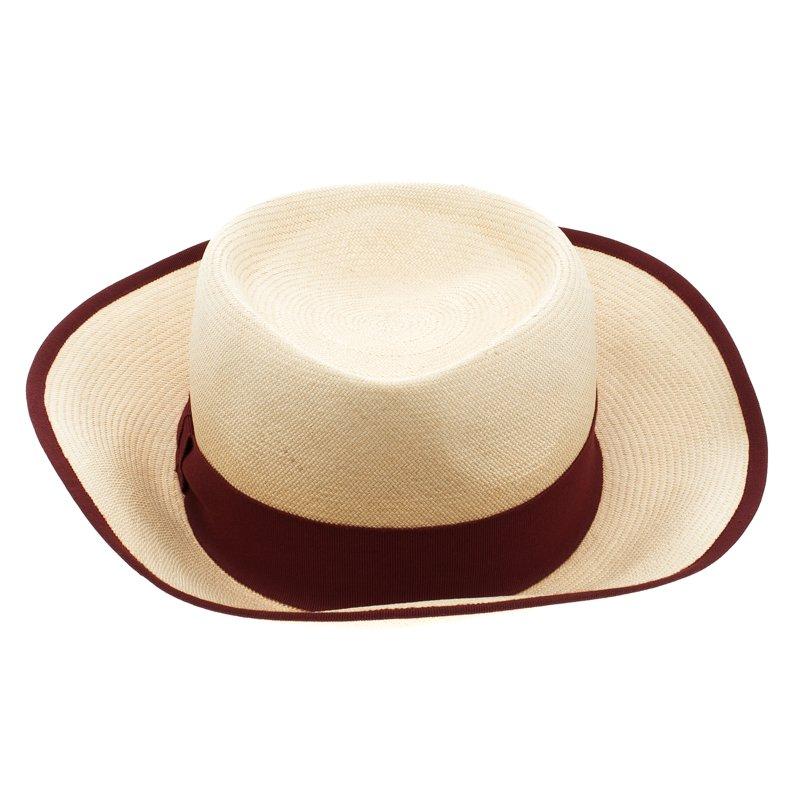 Beat the summer shade in this chic Panama hat from Hermes. Crafted in France from quality Panama, this hat features a basket weave pattern, a maroon ribbon band, and linings along the rim. Wear it over your casuals or take it along to the