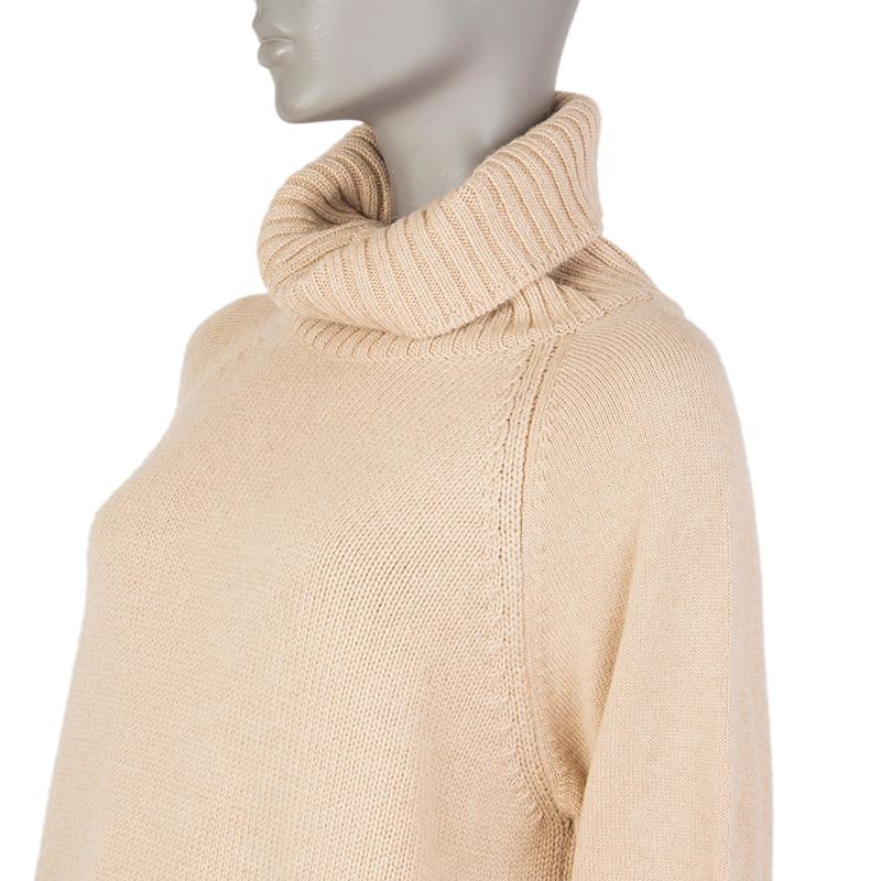 Hermes turtleneck wide sweater in beige camel hair (100%) with raglan sleeves and ribbed details. Has been worn and is in excellent condition. 

Tag Size 42
Size L
Shoulder Width 45cm (17.6in)
Bust 102cm (39.8in) to 110cm (42.9in)
Waist 108cm