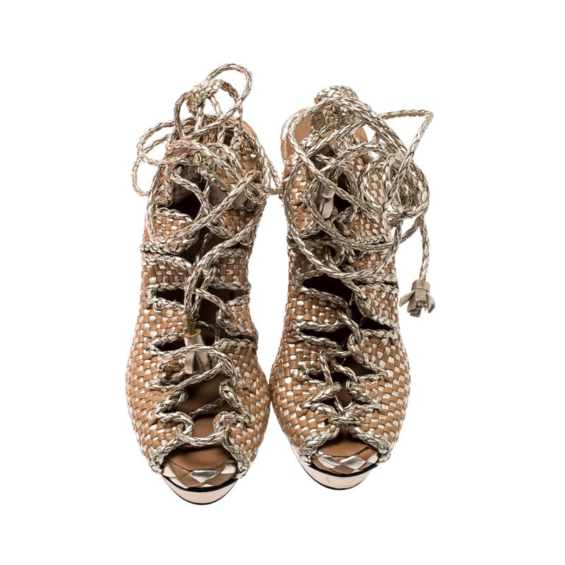 Visually stunning, these Hermes sandals are here to mesmerize and take your breath away! These sandals are crafted from braided leather and feature an open toe silhouette. They flaunt ankle wraps which are beautifully enhanced with tassels.