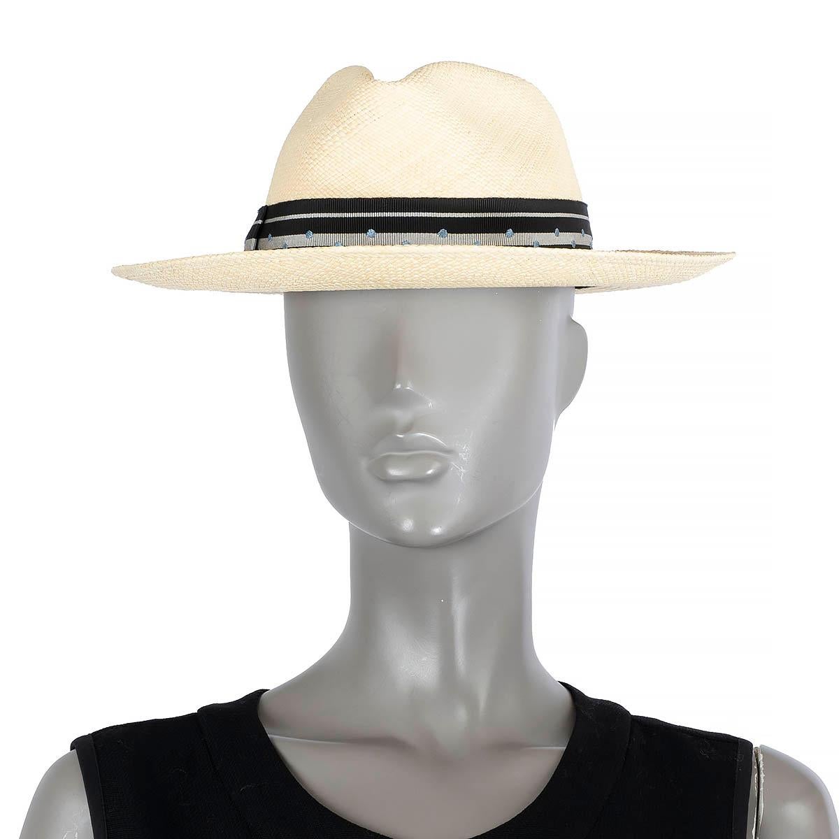 100% authentic Hermès Fedora hat in beige straw embellished with a black & silver striped grosgrain band with light blue polka-dots. Hermès Fedora hat in beige straw embellished with a black & silver striped grosgrain band with light blue