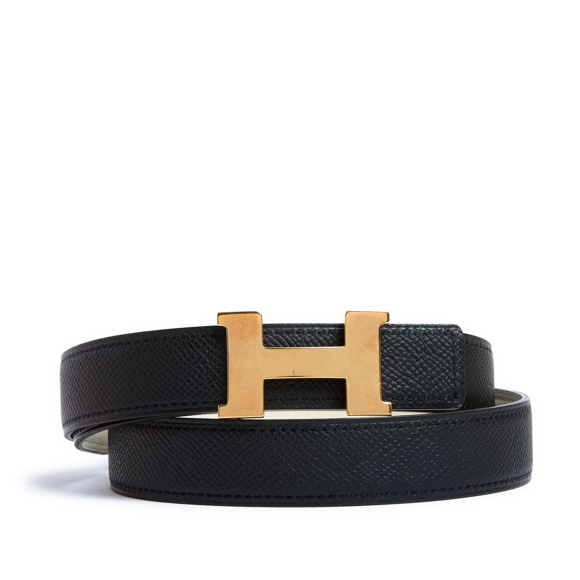 Hermès model A Composer belt including a Constance model belt buckle in rose gold-plated metal and a reversible black leather link on one side and ecru cream on the other, all delivered in its original box. Size 80: total length of the link 95 cm,