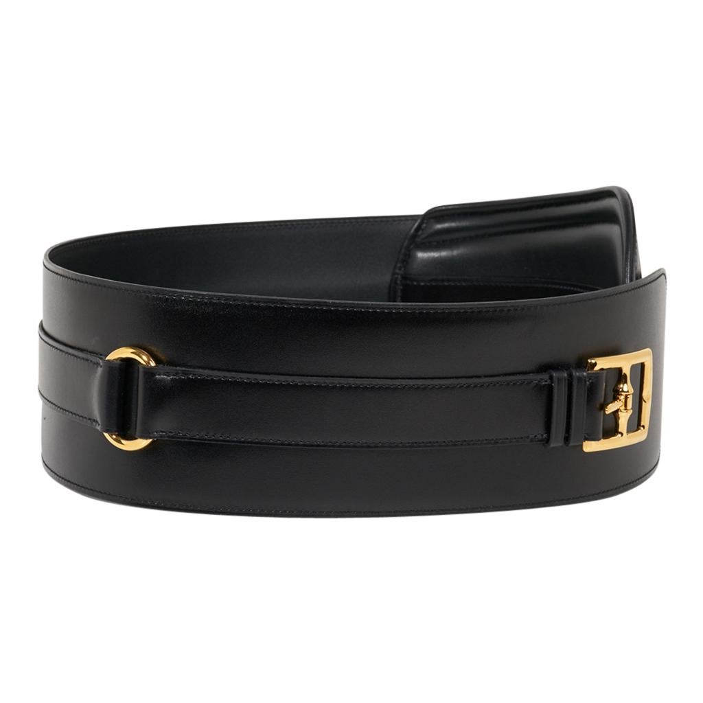 Mightychic offers an Hermes Black Clou de Selle high waist belt in Box leather.
This rare limited edition Hermes belt has beautiful shaping to accentuate your waist.
Exquisite Box leather with gold buckle and a Signature Clou de Selle. 
Signature