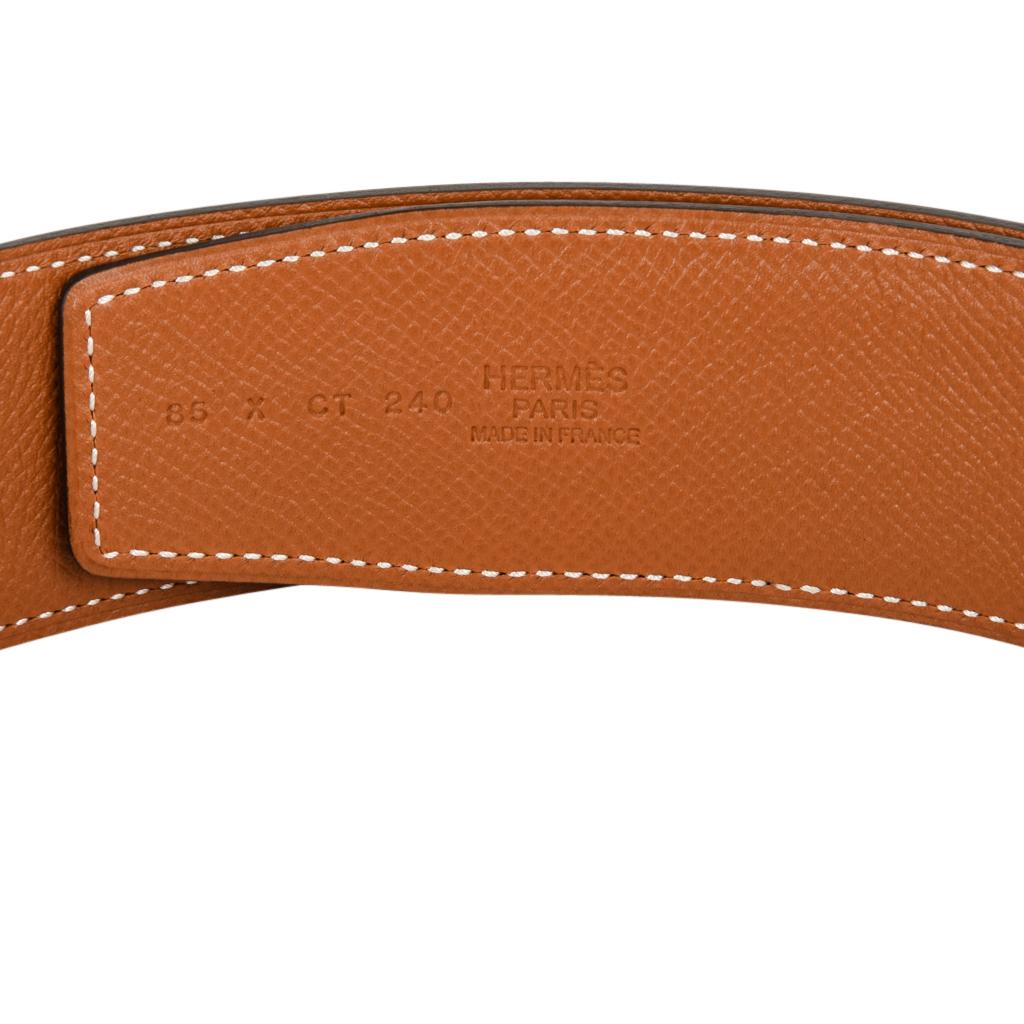 Guaranteed authentic Hermes Constance 42 mm belt features reversible Black to Gold epsom leather.  
Fabulous over sized brushed palladium Signature H buckle.  
Now a retired size, this is sure to become a collectors treasure. 
Signature HERMES PARIS