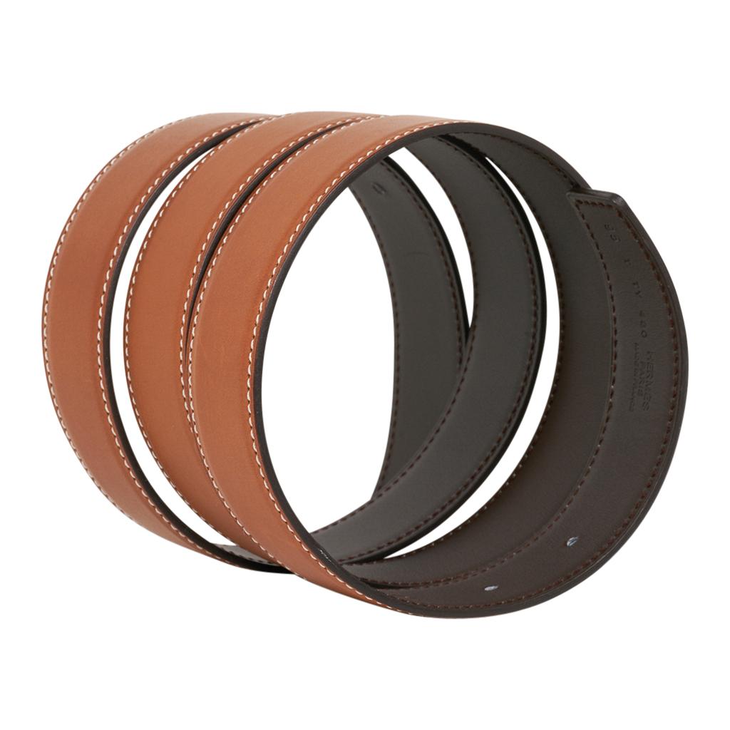 Guaranteed authentic Hermes coveted reversible 32mm Constance H belt featured in rare Fauve Barenia reversible to Dark Brown leather. 
Paired with the Street Laquer buckle in black. 
Signature HERMES PARIS MADE IN FRANCE is stamped on the belt. 
NEW