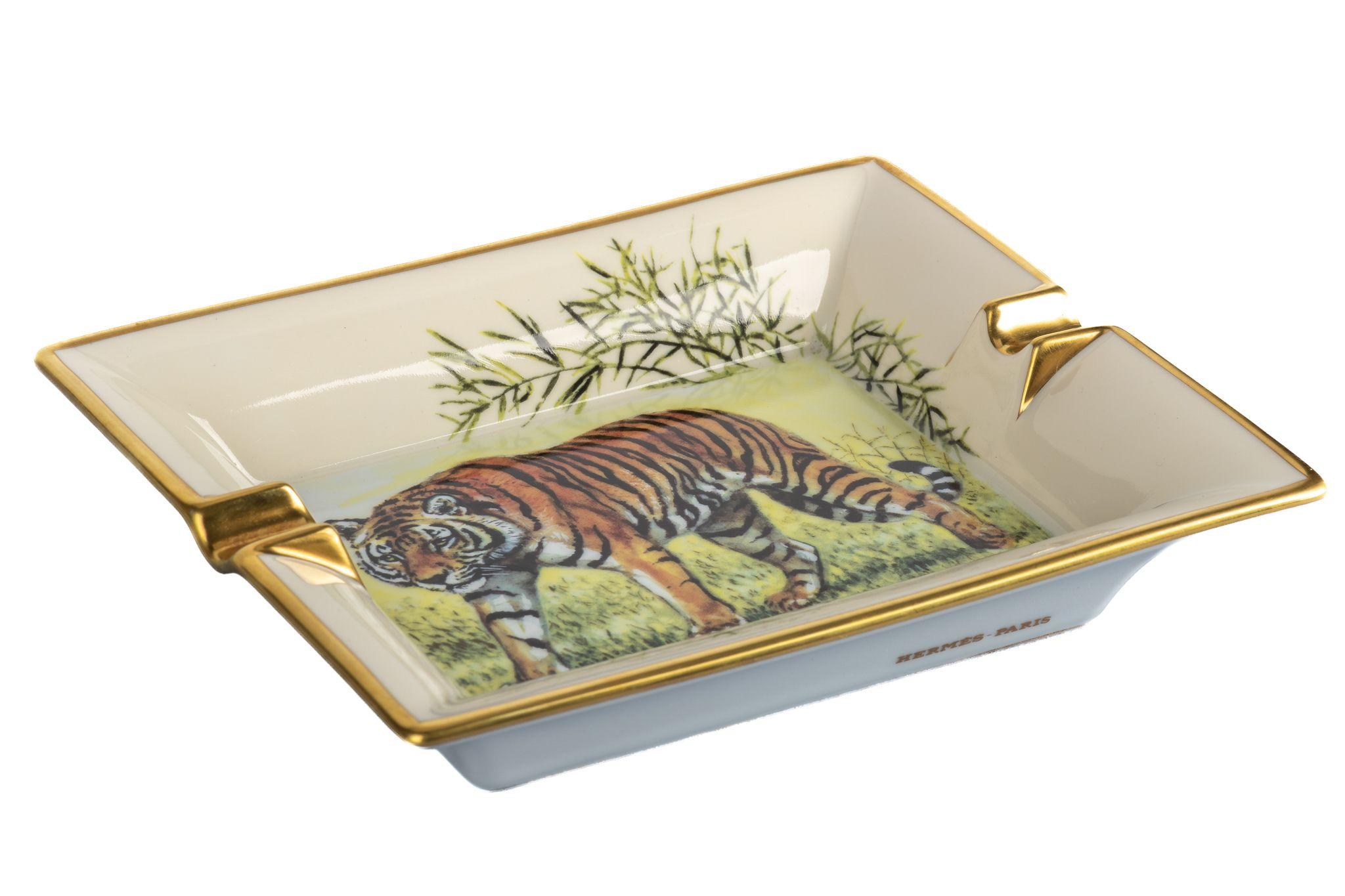 Hermes signature ashtray with tiger design in white and gold. Suede stamped bottom. Made in France.