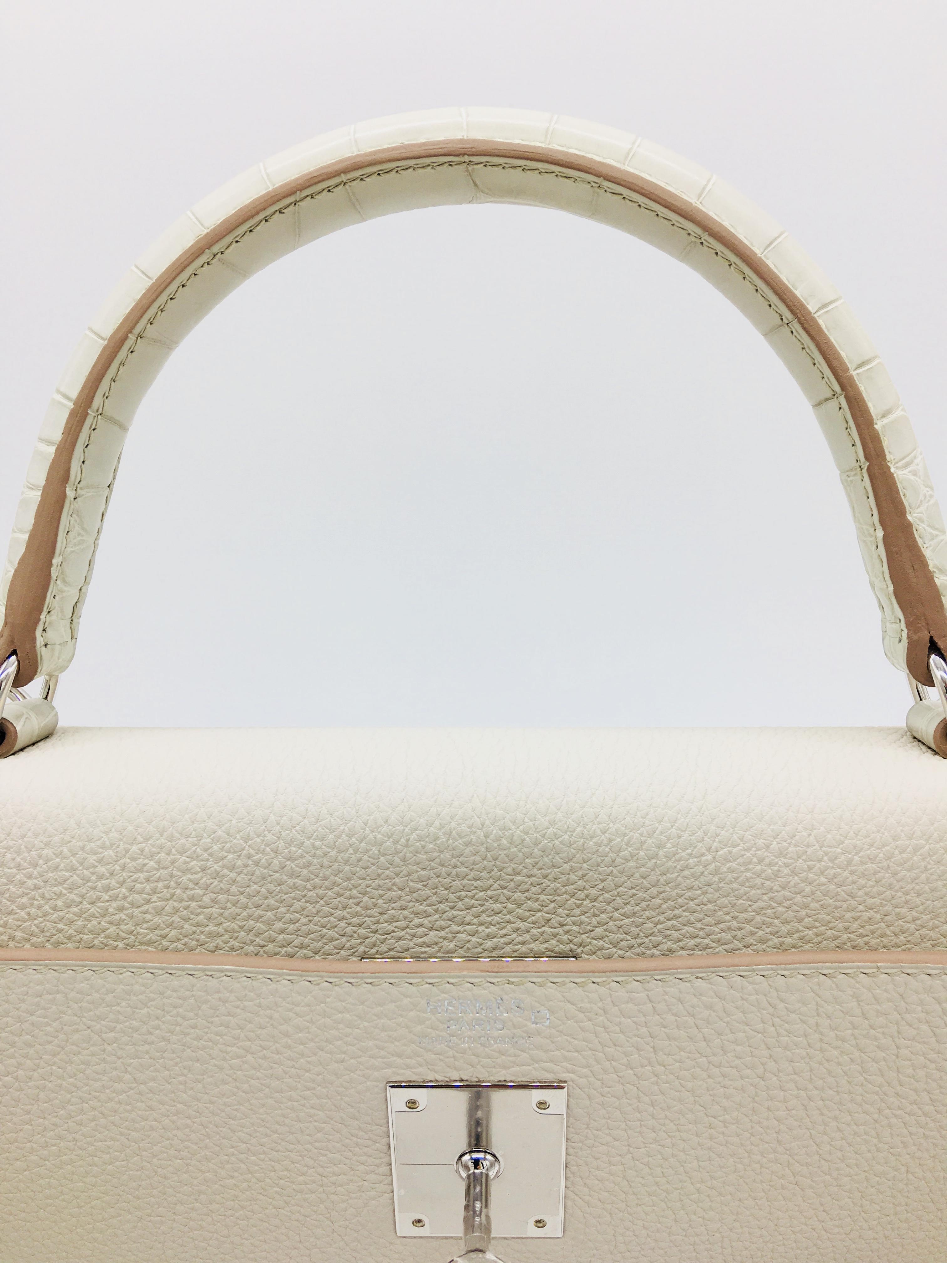 The Kelly Touch is an interesting and different combination from Hermes which was introduced towards the end of 2017.  The body of the bag is in Togo leather whilst the handles are in Crocodile, adding a subtle but distinctive “touch”.  This 32cm