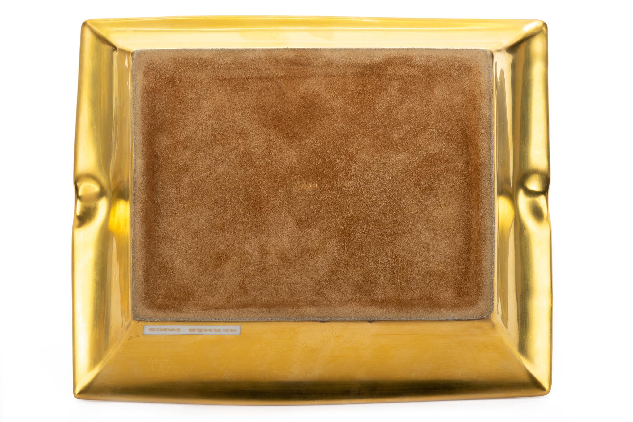 Hermes signature porcelain ashtray with bird design in yellow, white an gold. Suede stamped bottom. Made in France.