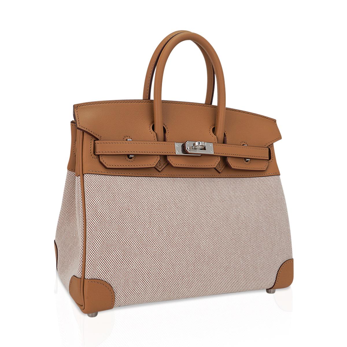 Mightychic offers a limited edition Hermes Birkin 25 bag featured in coveted Toile H in beige and ecru with Biscuit Swift leather.
This prized Toile Birkin in a 25 is virtually impossible to find, and true collectors treasure.
Rich neutral Hermes