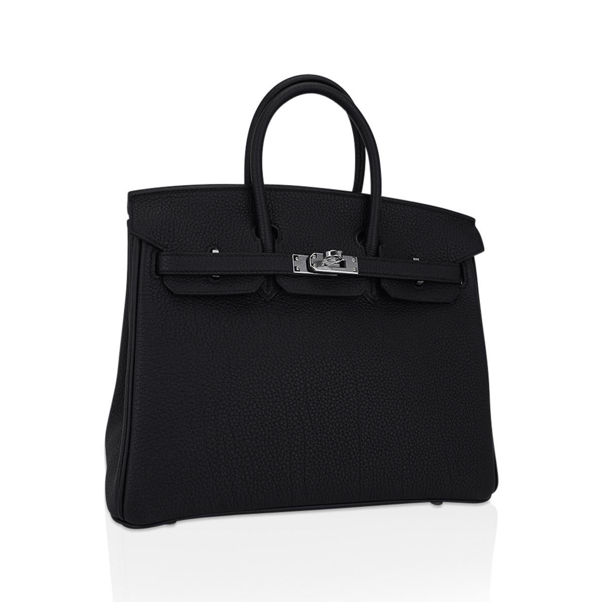 Mightychic offers an Hermes Birkin 25 bag featured in Black.
This beautiful Birkin bag is crisp and fresh with Palladium hardware.
Lush Togo leather is supple and scratch resistant.
Comes with lock, keys, clochette, sleepers, raincoat and signature