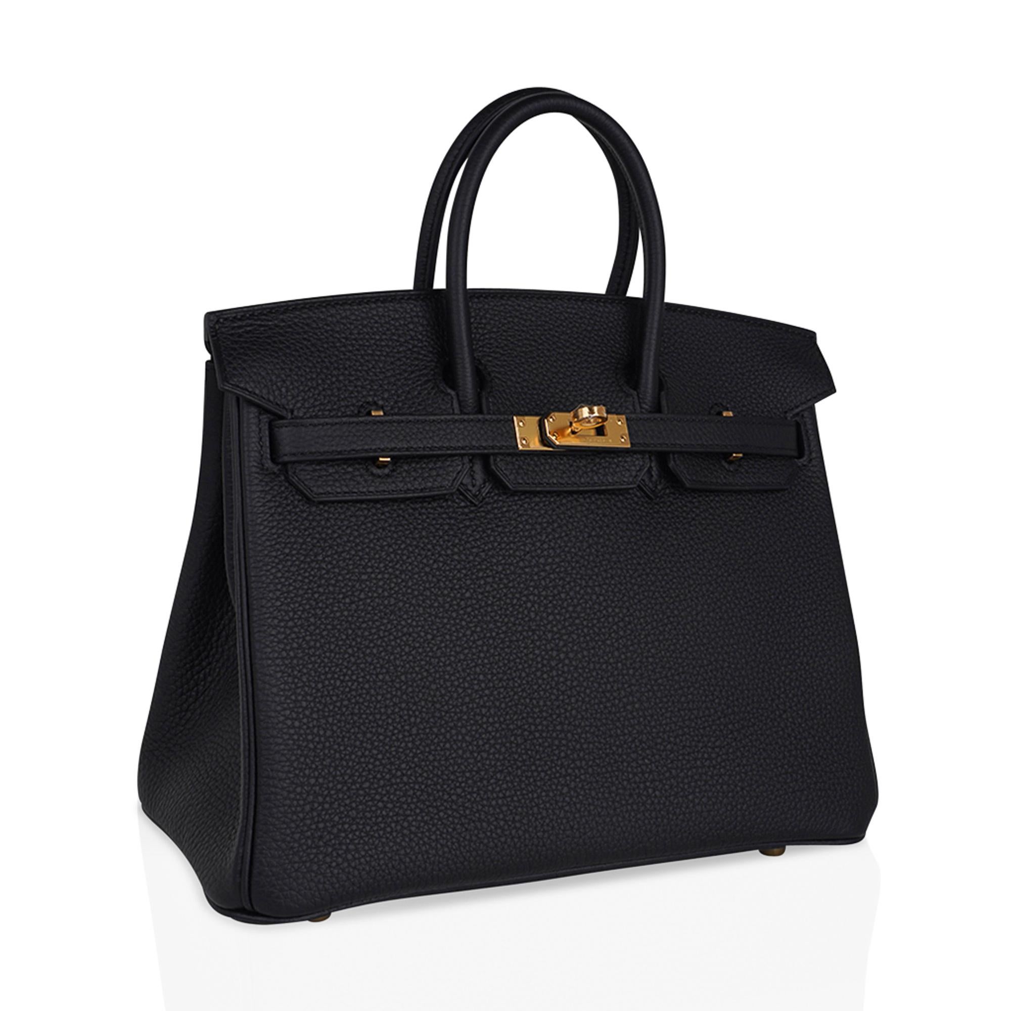 Mightychic offers an Hermes Birkin 25 bag featured in classic Black togo leather.
Rich with gold hardware this beauty is a chic bag day to evening.
Lush Togo leather is supple and scratch resistant.
Comes with lock, keys, clochette, sleepers,