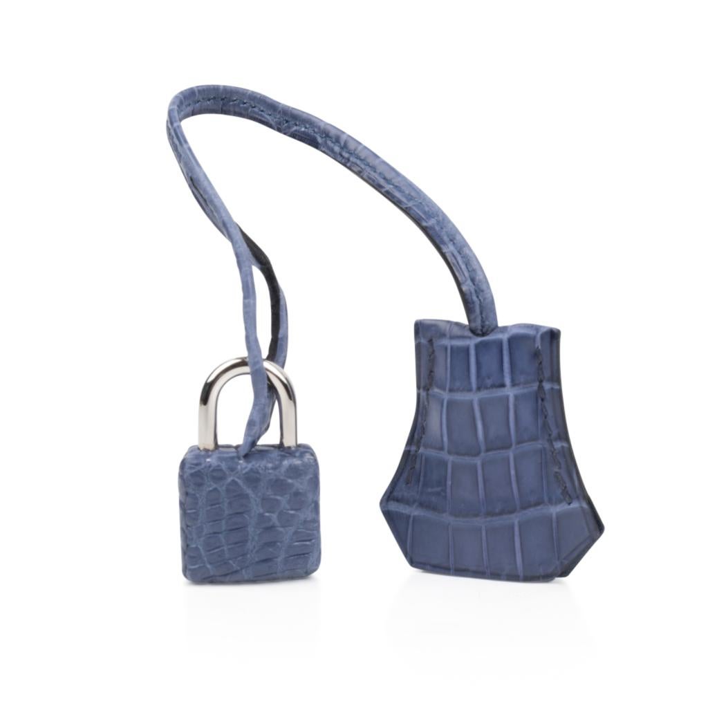 Coveted rare Blue Brighton matte crocodile Hermes Birkin 25cm bag accentuated with fresh Palladium hardware.
This divine blue is neutral and easily moves from day to night.
NEW or NEVER WORN  
Comes with the lock and keys in the clochette, signature