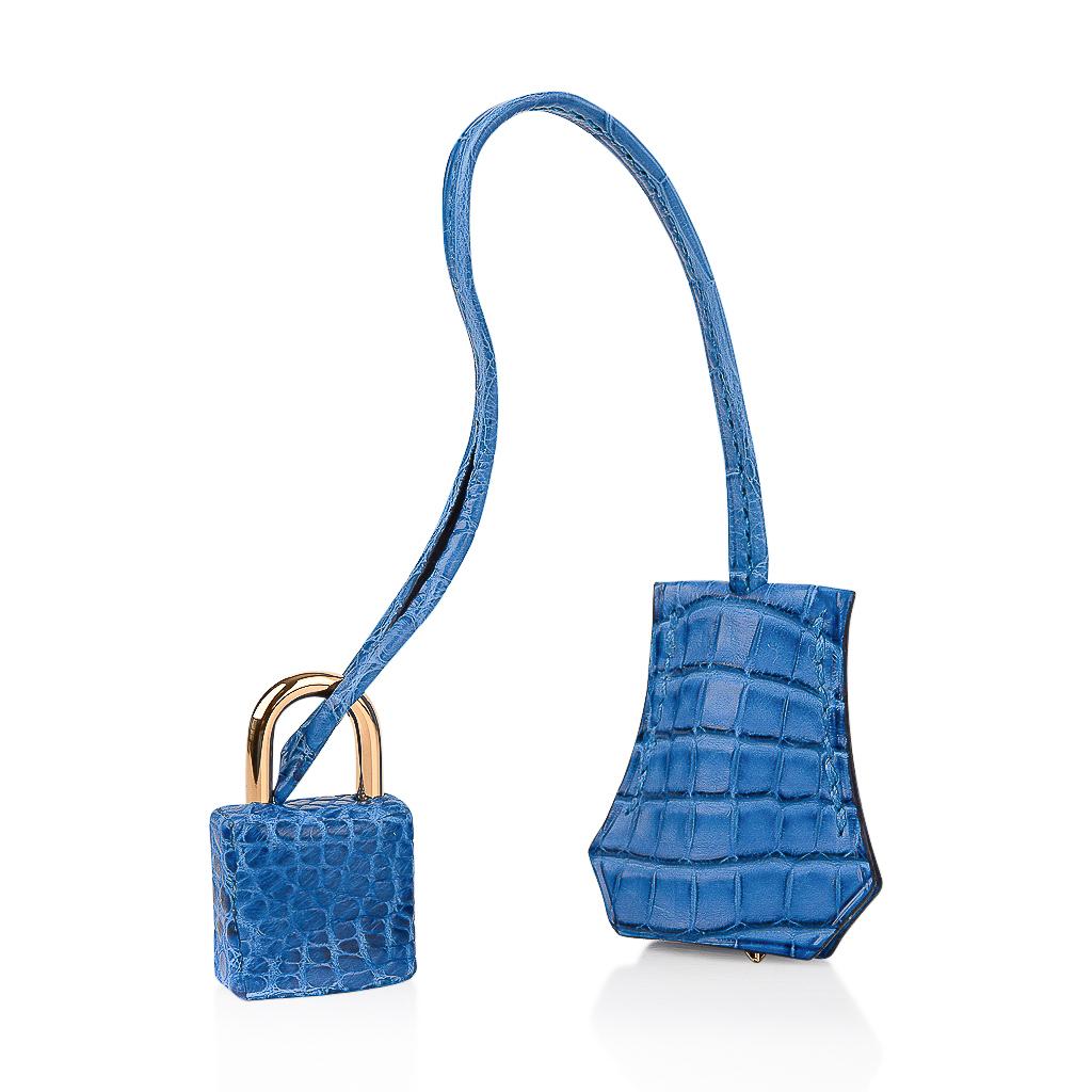 Hermes Birkin 25 bag features Blue Zellige in Matte Alligator. 
Richly saturated blue zellige has a beautiful depth of color. 
Lush with gold hardware.
Comes with lock, keys, clochette, sleepers, raincoat, signature Hermes box and ribbon.
final