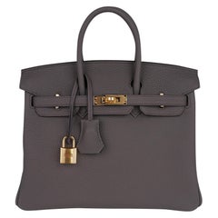 Sac Hermès Birkin 25 en cuir Togo étain finitions métalliques dorées, neuf dans sa boîte