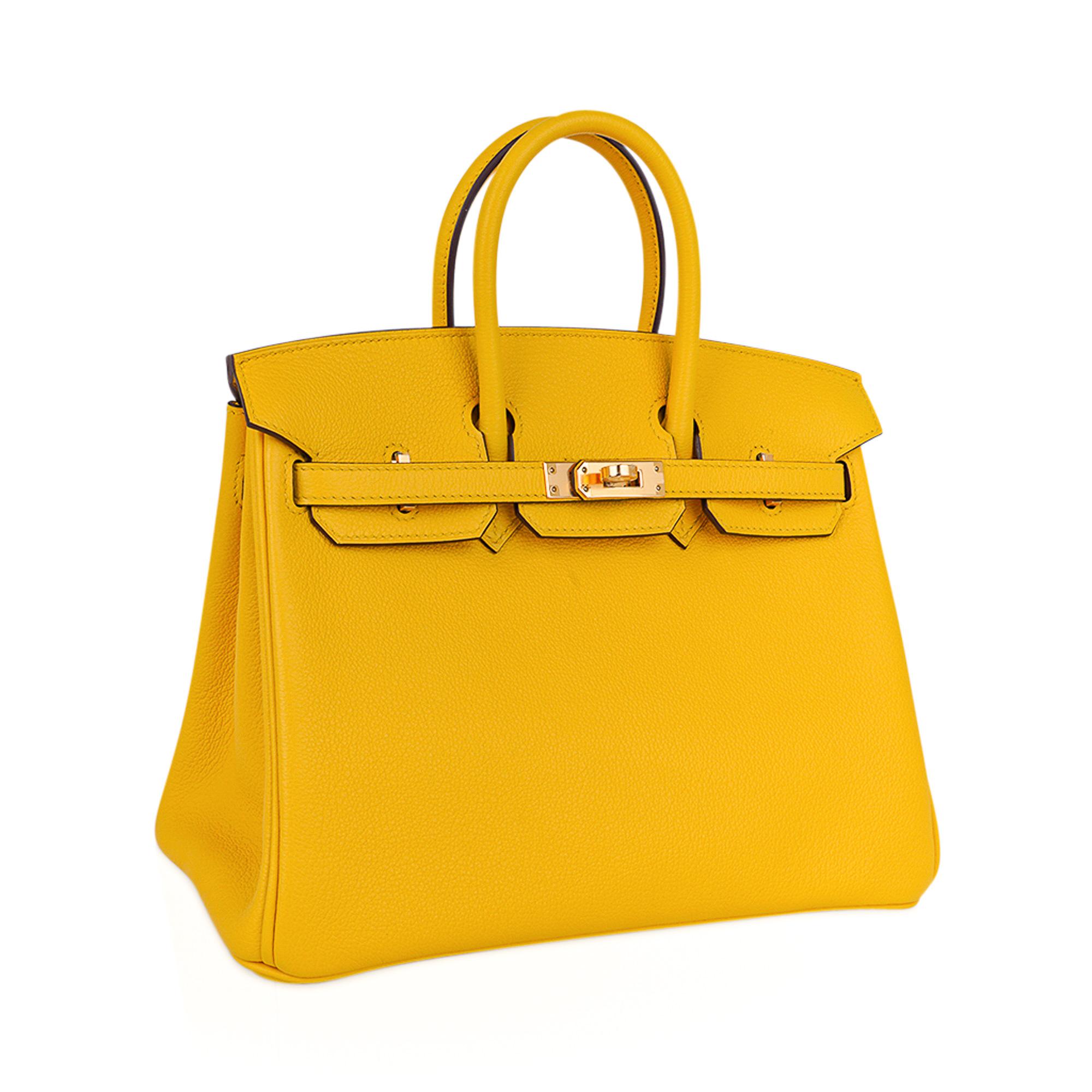 Mightychic offers an Hermes Birkin 25 bag featured in Jaune de Naples.
This beautiful warm yellow is a beautiful year round color!
Lush with Gold hardware.
Bull leather, Taurillion Novillo has a far finer grain than clemence or togo, and is lighter