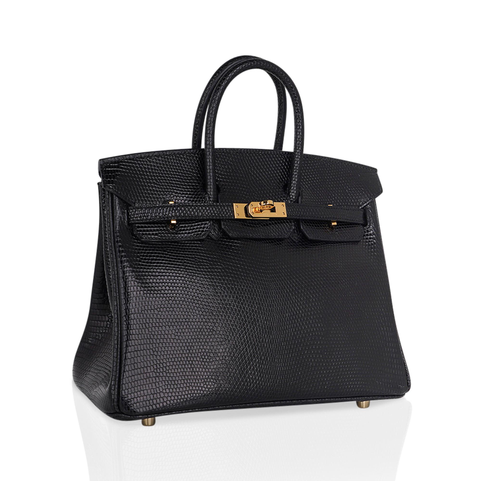 Mightychic offers a limited edition Hermes Birkin 25 bag featured in  Black Lizard.
This extremely rare Hermes Birkin bag is elegant, timeless and absolutely stunning.
Accentuated with lush Gold hardware.
Comes with the lock, keys, and clochette and